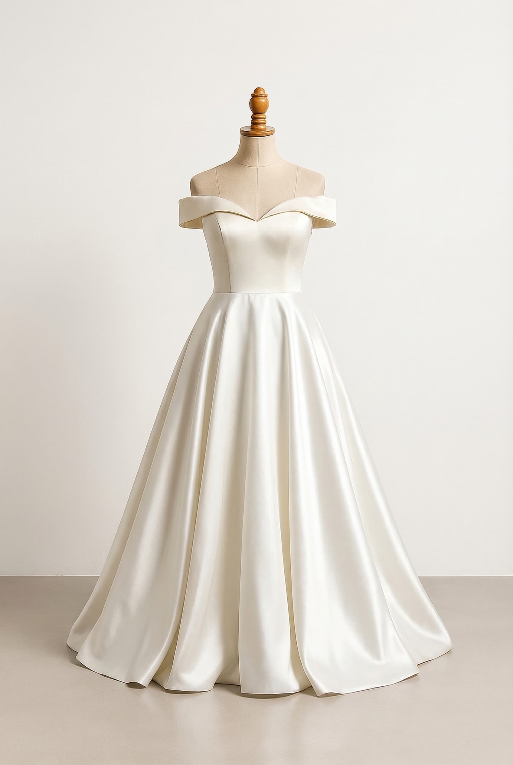 Full length circle skirt with ivory satin fabric off-shoulder top with eggshell coloured satin cloth