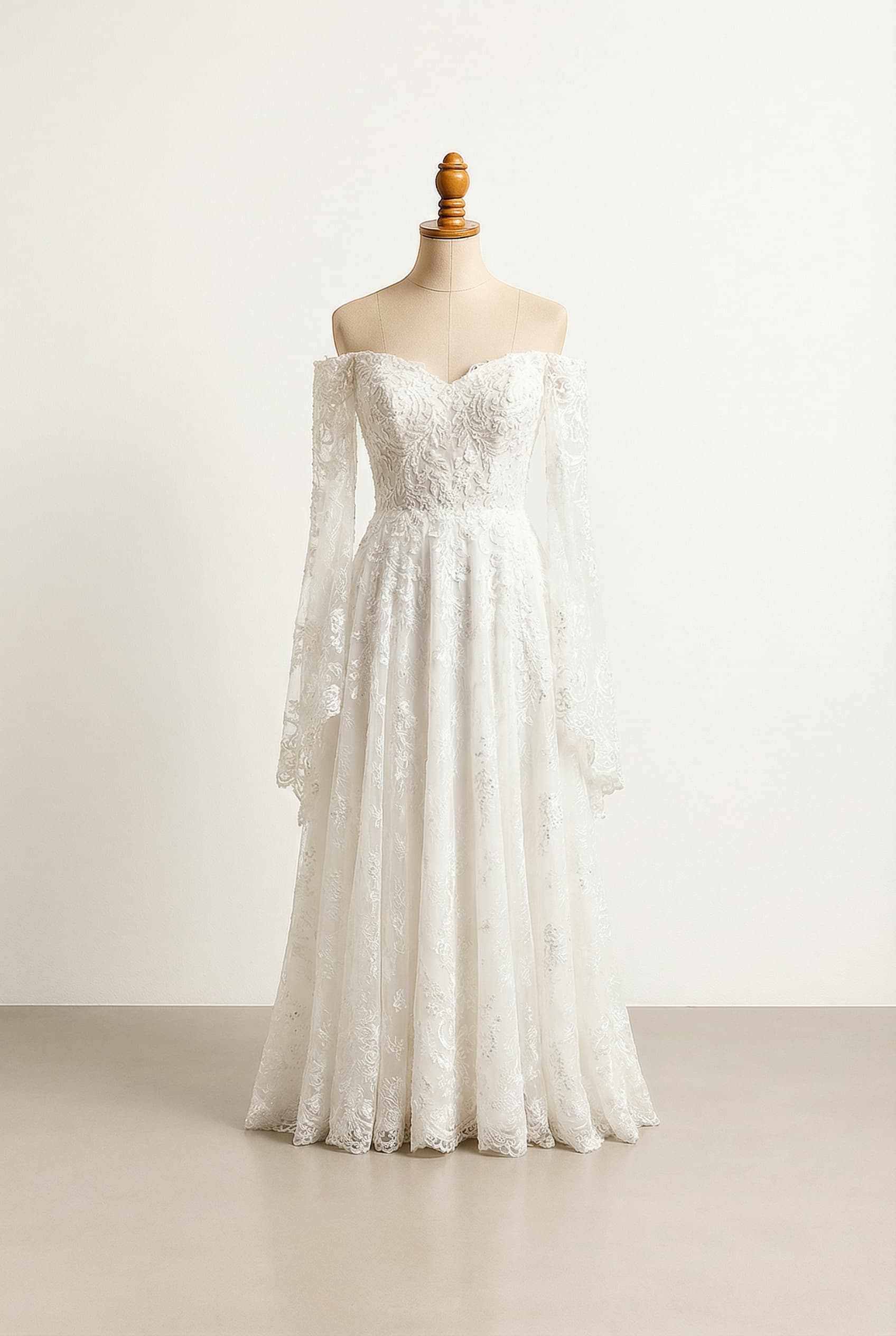 A romantic wedding dress with elegant details, a Sweetheart neckline, off-the-shoulder long flowy sleeves, an A-line silhouette, and a bodice adorned with lace and beading.