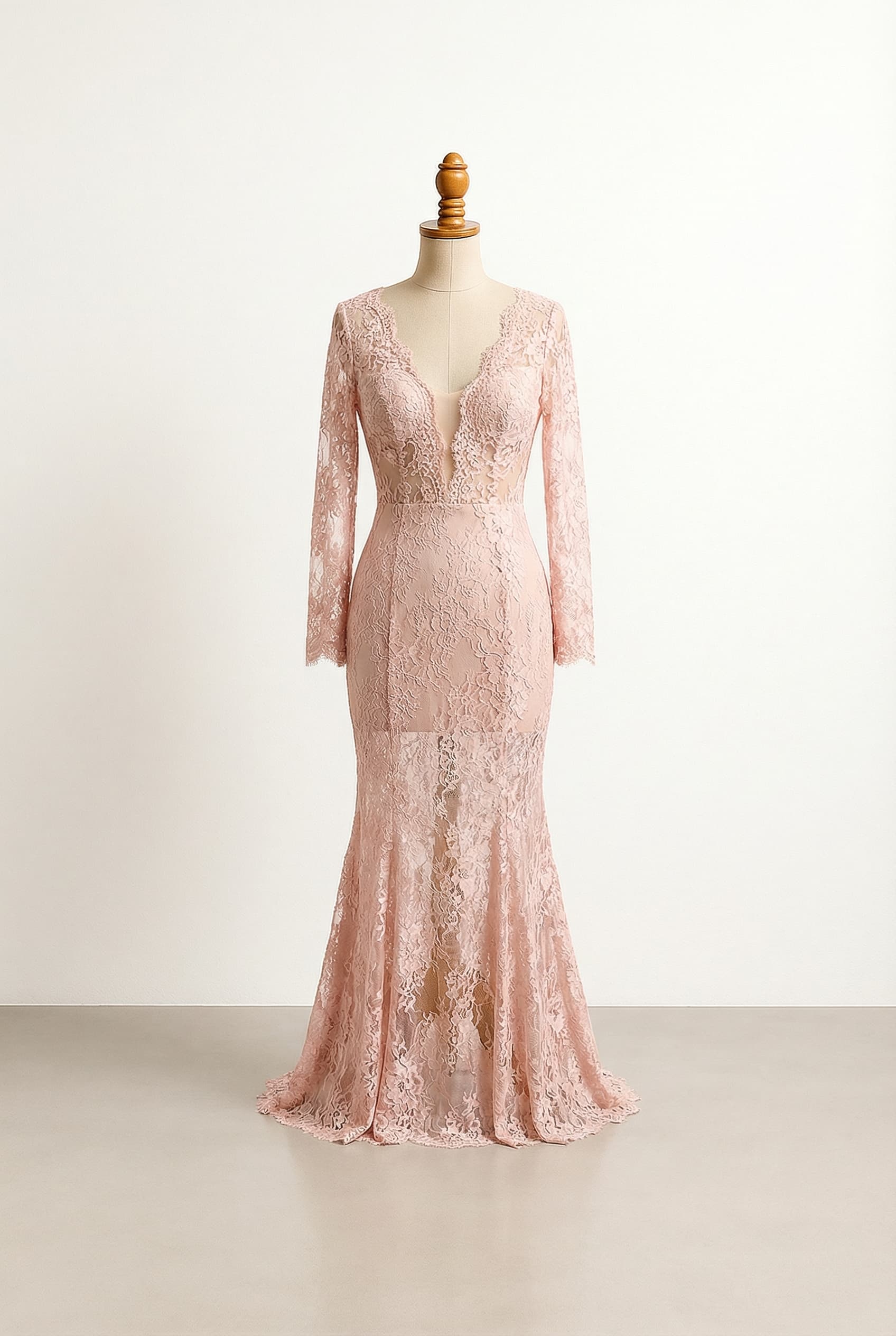 Very tight Mermaid dress with see-through lace details all the way until the knees and a plunge neckline