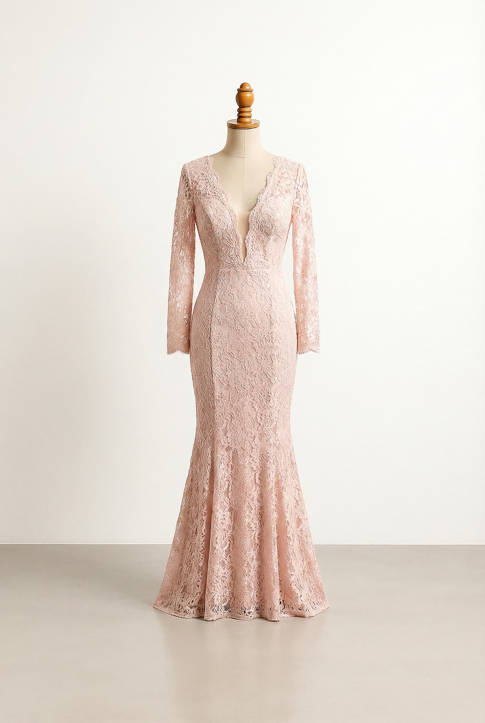 Very tight Mermaid dress with see-through lace details all the way until the knees and a plunge neckline