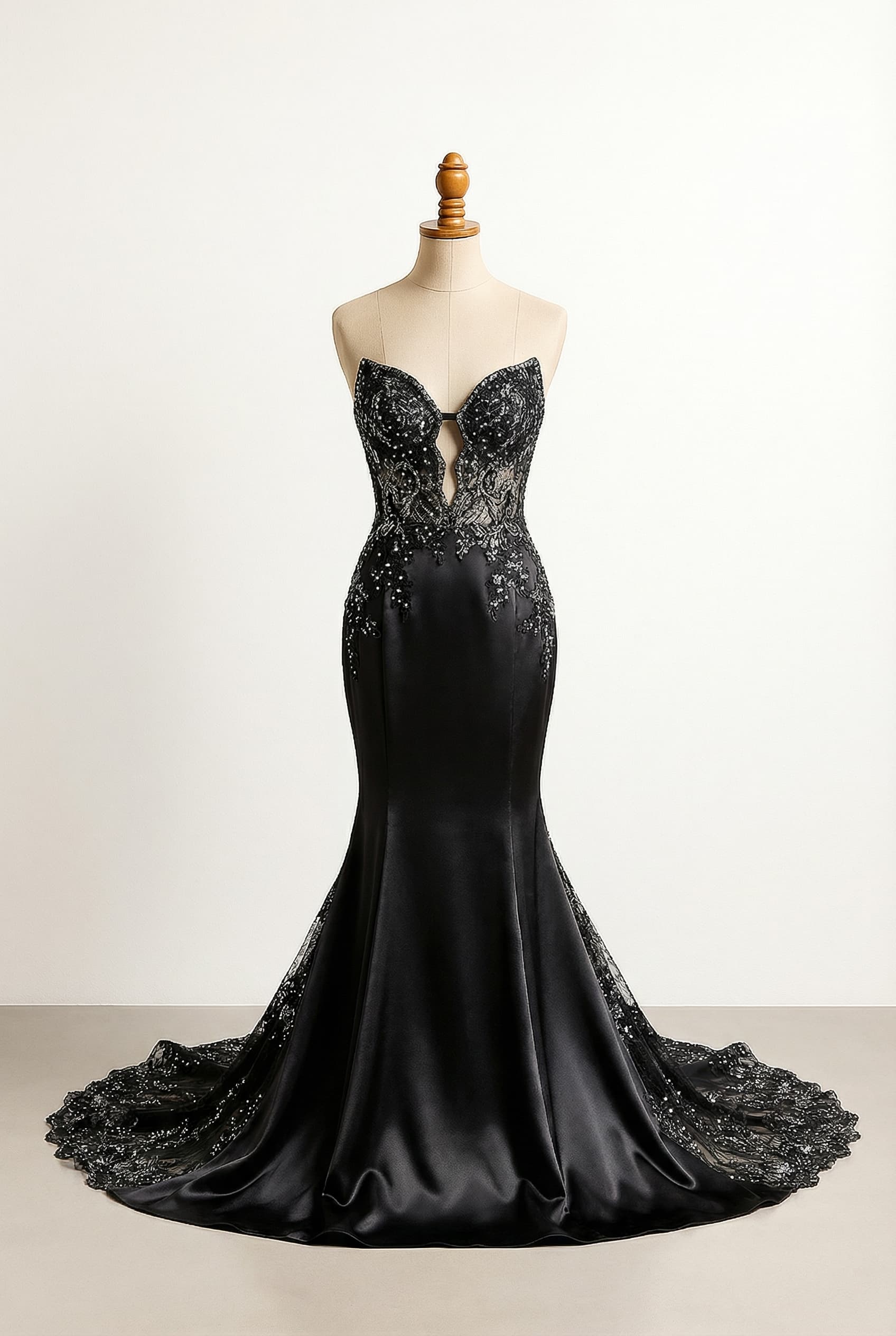 Black luxurious satin mermaid gown with black and silver lace and bright sparkle in the chapel train and peek a boo sharp sweetheart neckline