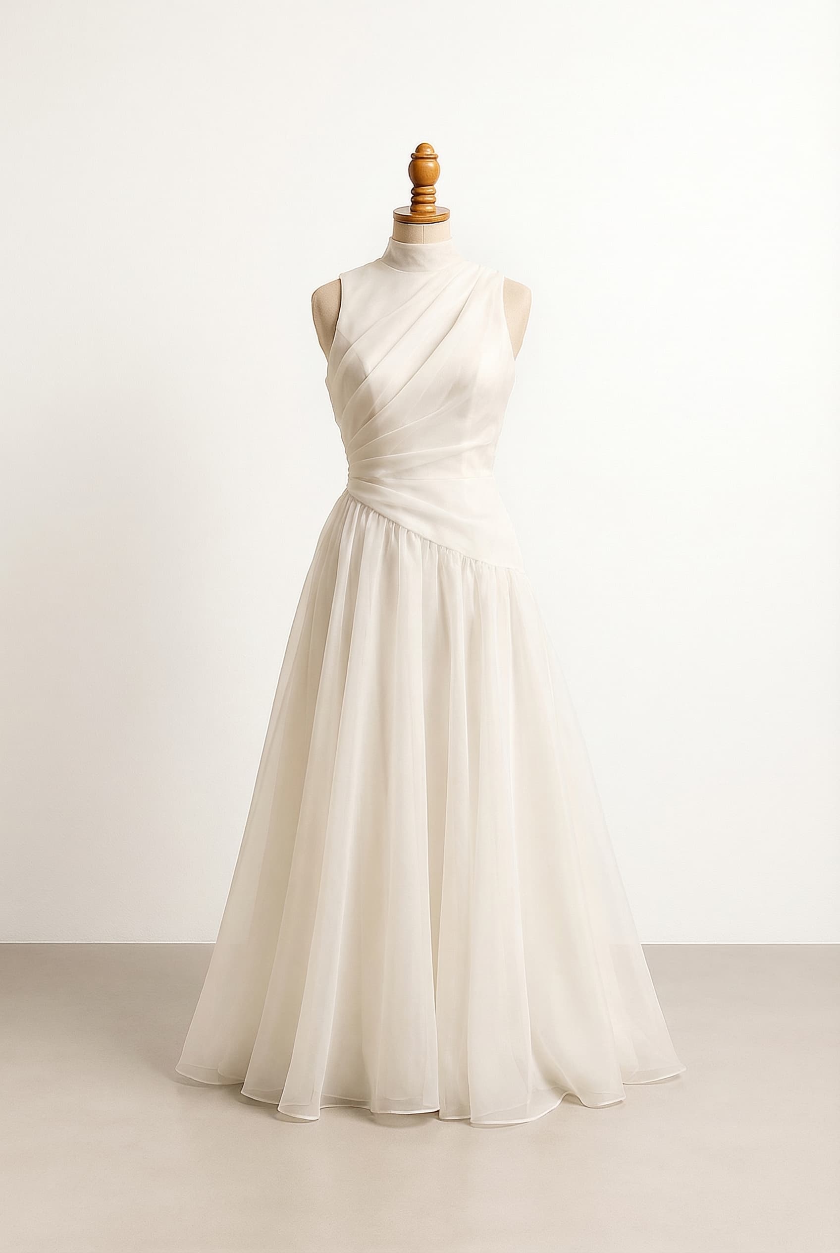 I want a balanced wedding dress with an A-line organza or chiffon skirt fitted bodice with slightly dropped waist sleeveless draped fabric over bodice covers shoulders, skirt longer, boat neckline