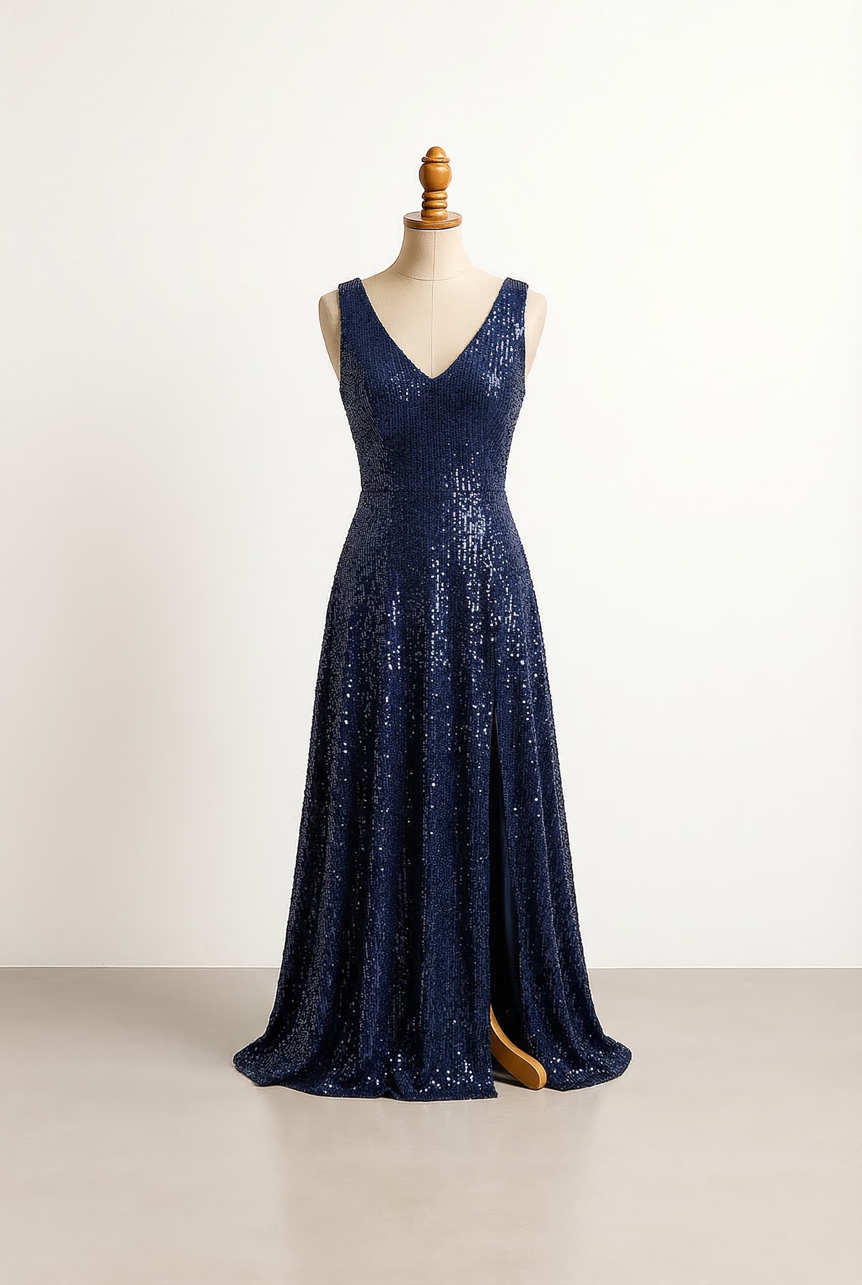 I want a balanced prom dress navy blue with a slit on the right fitted at the waist and flowing at the bottom with corset detailing and thinner straps