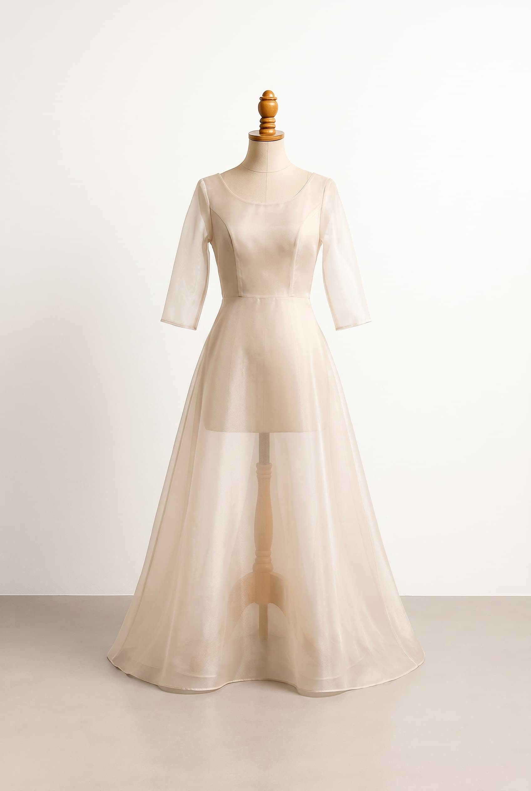 A balanced, ethereal wedding dress with a soft romantic impression. Designed for easy movement at an outdoor wedding, focusing on a lightweight, airy feel with elegant, modest coverage.