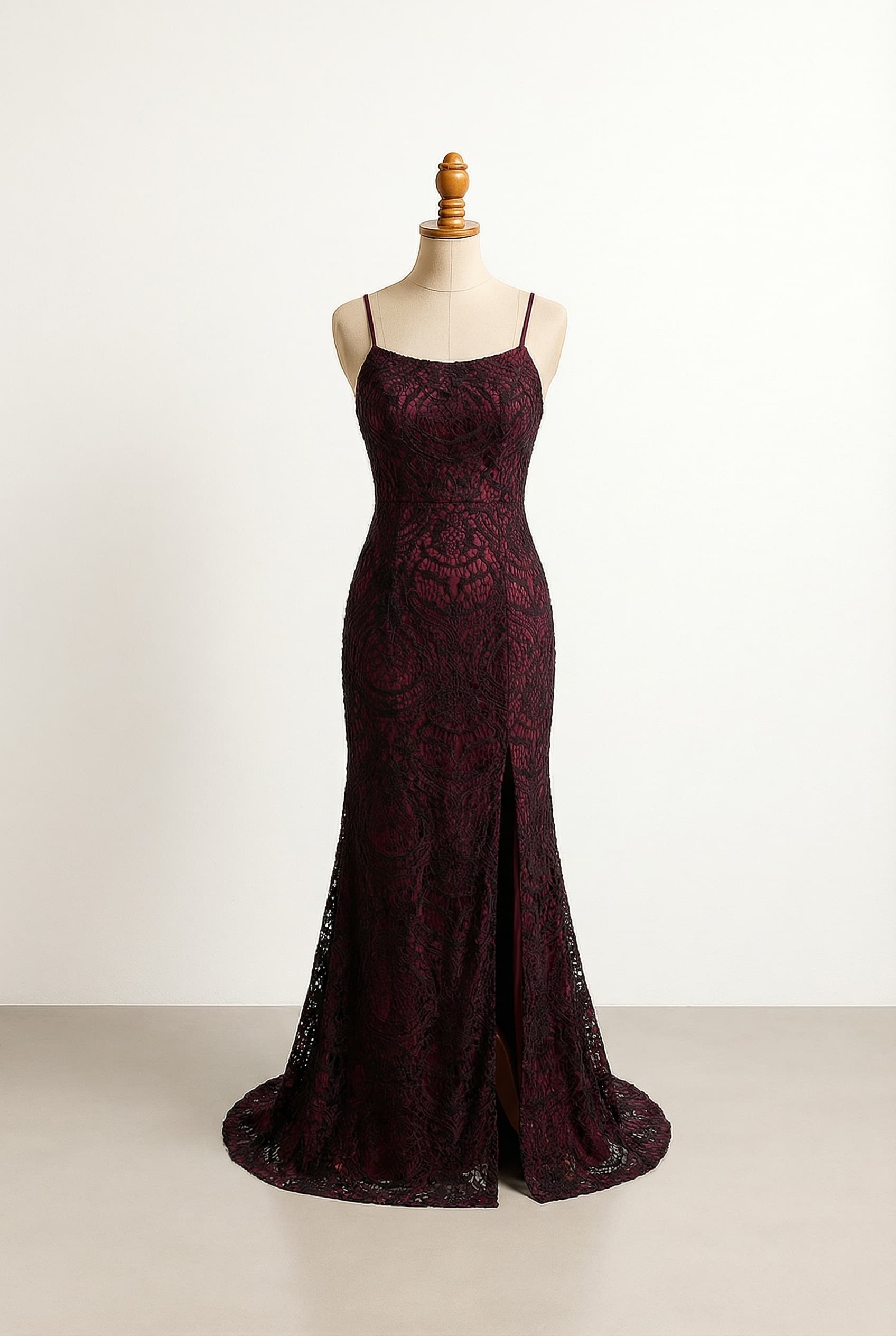 Dark red prom dress with thin straps and a slit in leg