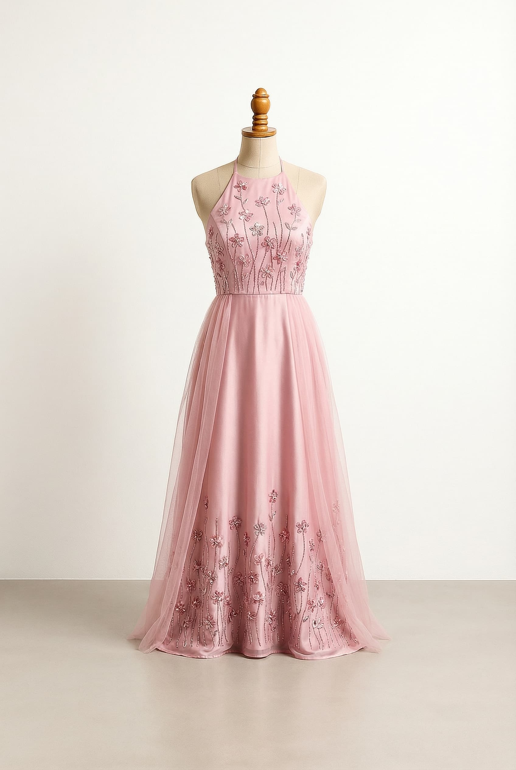 Silk Halter neck line with flower and line whimsical beading on the top empire waist flowy ish silk skirt with the same flower line whimsical beading starting at the bottom of the dress and fading out as it goes up beads should not pass the knees with tulle coming over starting from each hip crossi