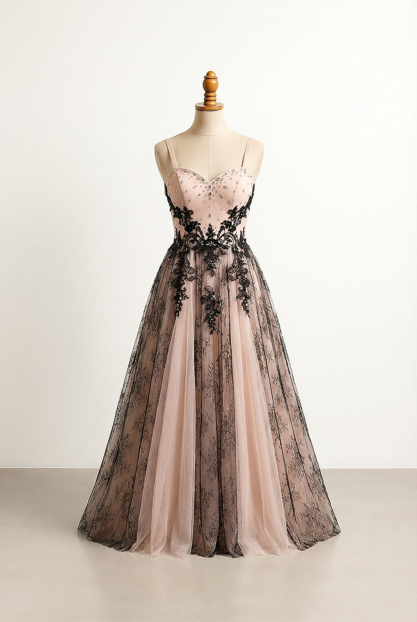 A romantic wedding dress with elegant details, with scattered gemstones on the bodice and delicate lace continuing down the dress.