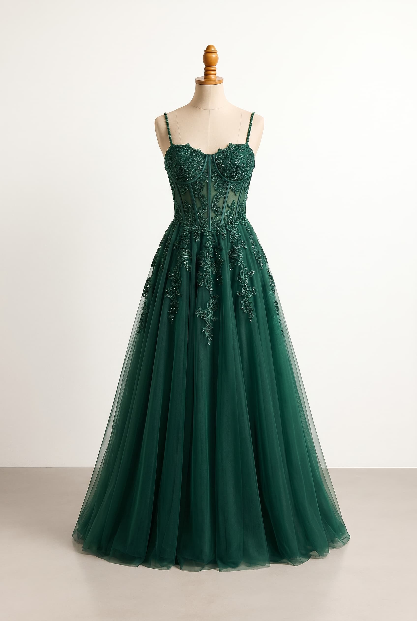 Balanced dark green prom dress with a more structured corset bodice off-the-shoulder draped sleeves white elbow-length gloves and a very voluminous A-line skirt with lace and beading