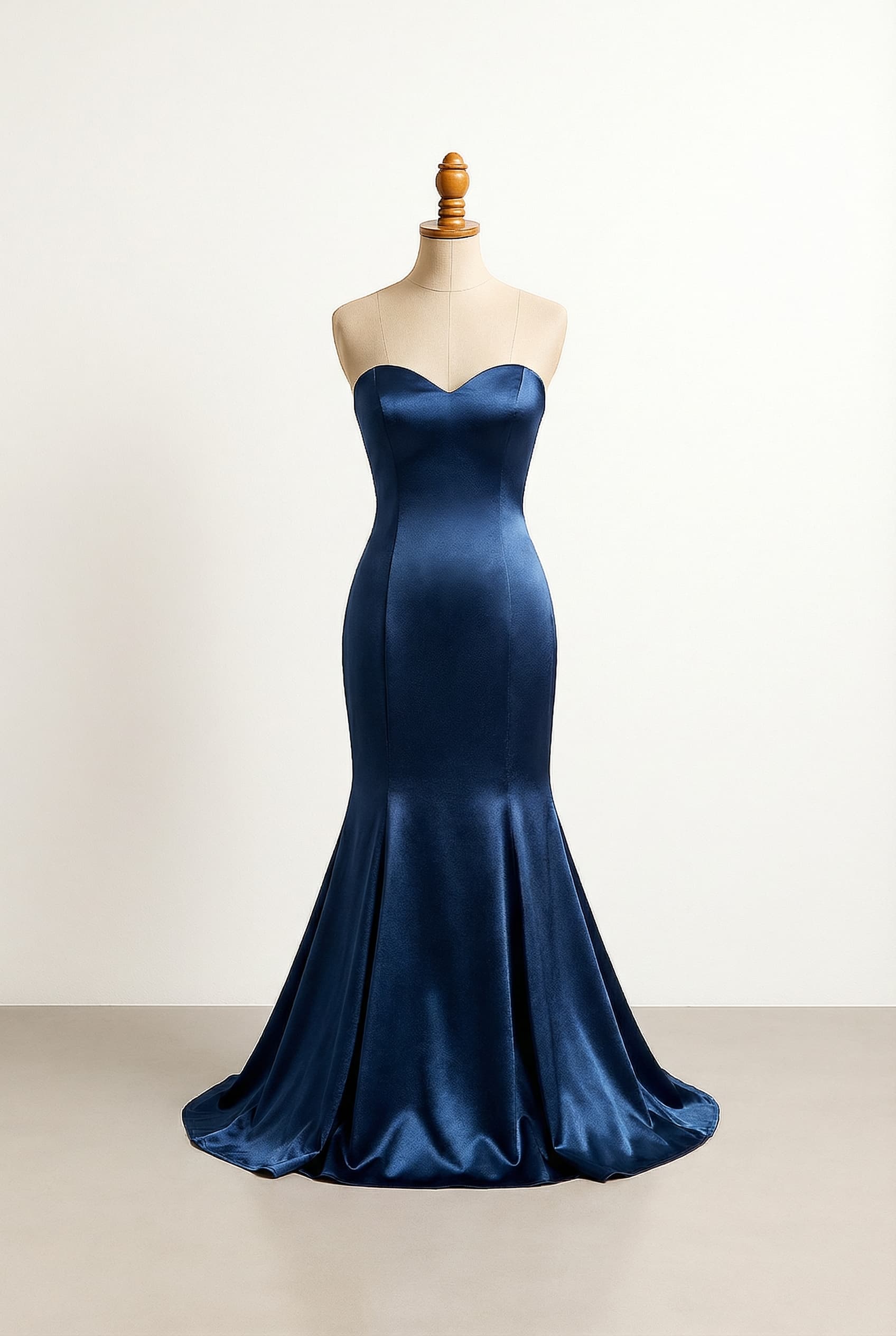 Glamorous prom dress, Classic Hollywood style, inspired by black women, in a dark shimmering blue with an open back.