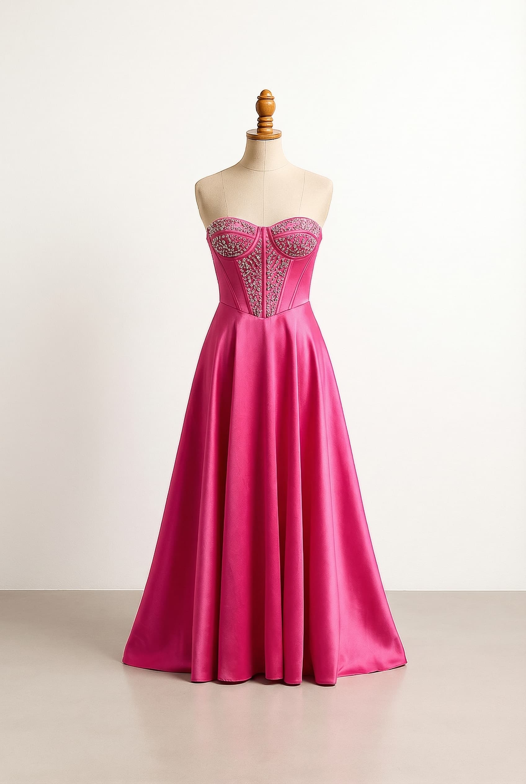 I want a balanced prom dress, corset dress, long and satin that is flowy on the bottom it has rhinestones on the corset and the color is dark pink