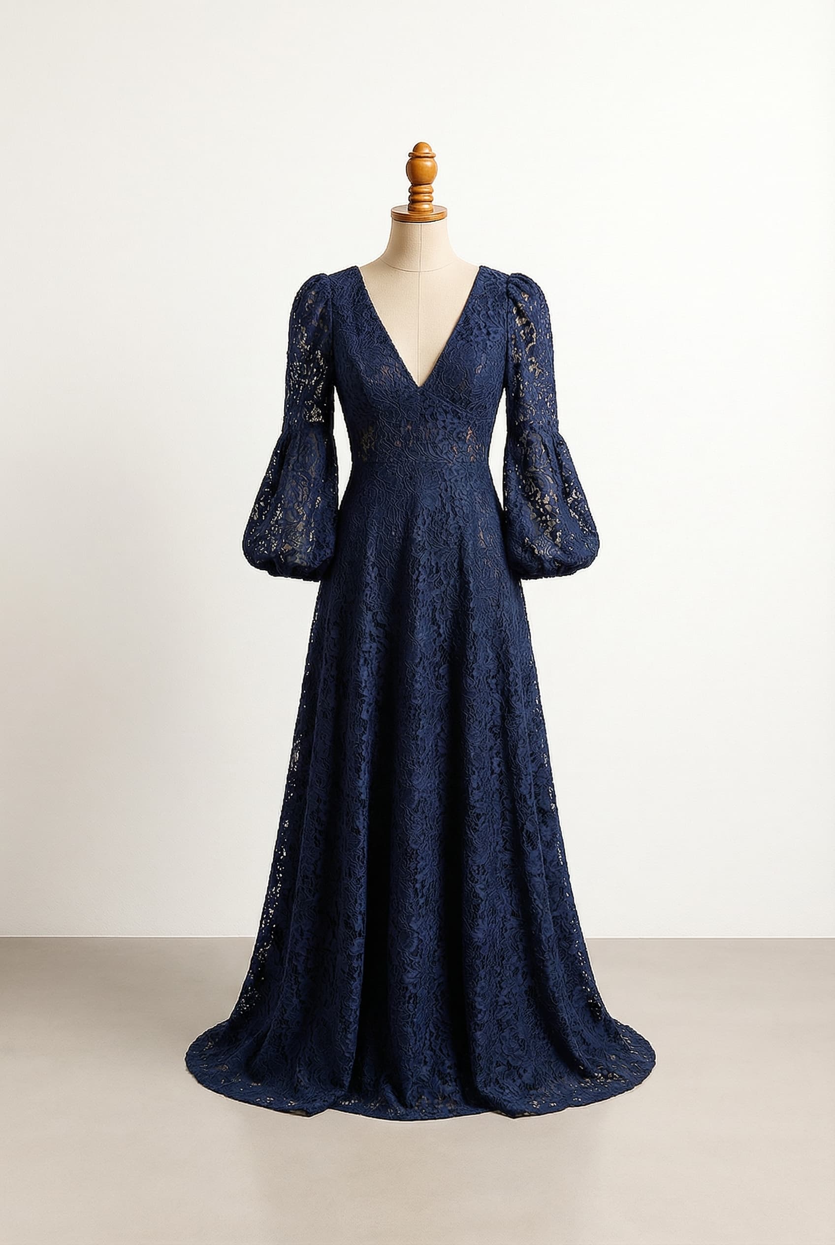 Balanced bridesmaid dress full length navy blue lace full overlay full puffed bishop sleeves deep V-neckline fitted bodice A-line skirt