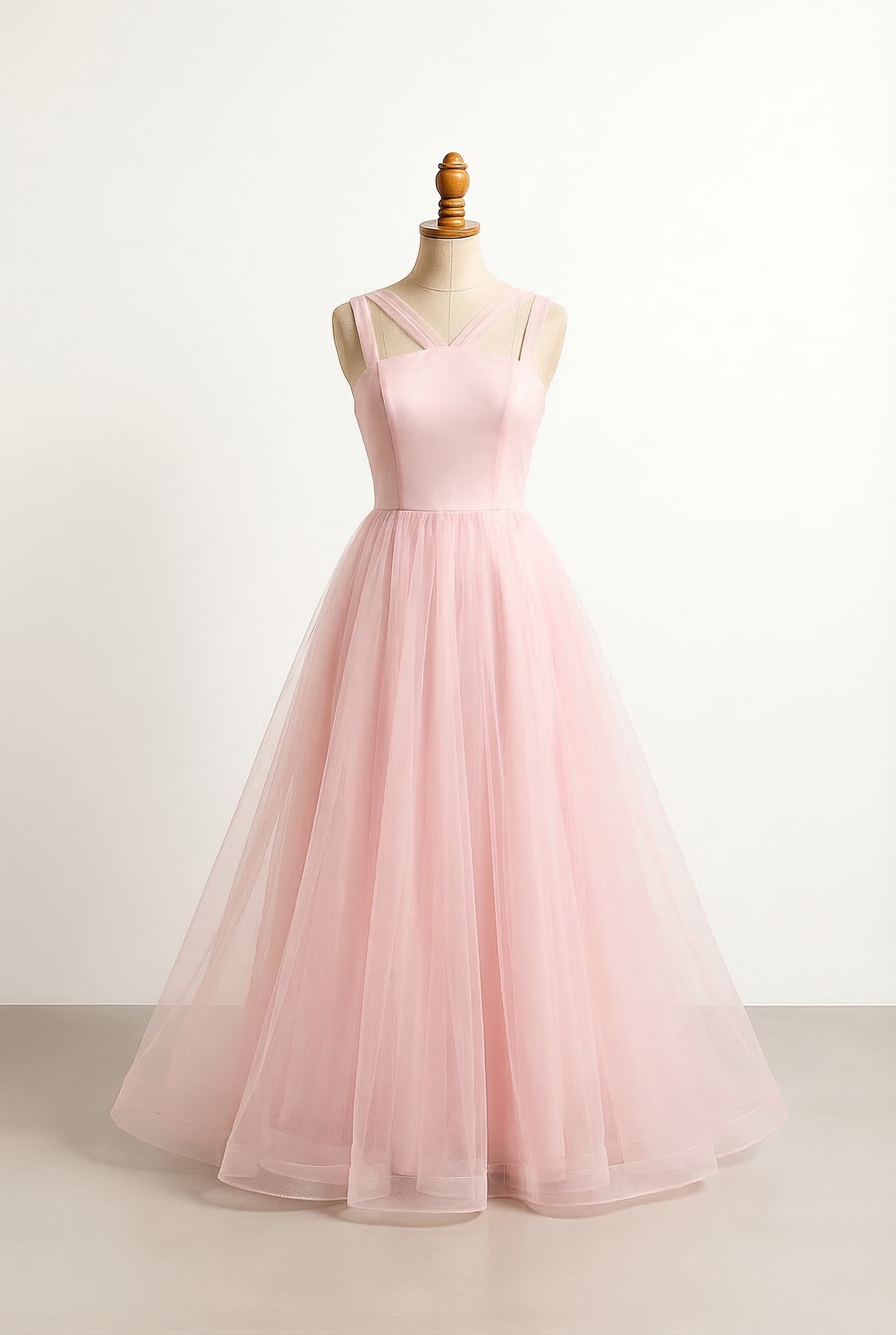 I want a balanced prom dress with a flare skirt and semithick straps and a delicate criss cross neckline with a skinny silhouette and the breasts to criss cross and the skirt to be layers a straight and the too part to be a single layer