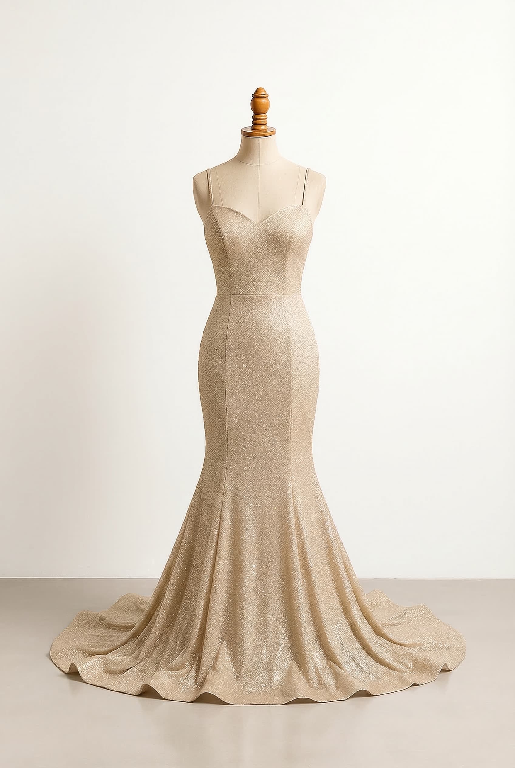 Mermaid dress with spaghetti straps sweetheart neckline sparkly threaded top and sparkly bedazzled skirt in champagne gold gold sheer top with subtle corset partially sheer bedazzled skirt