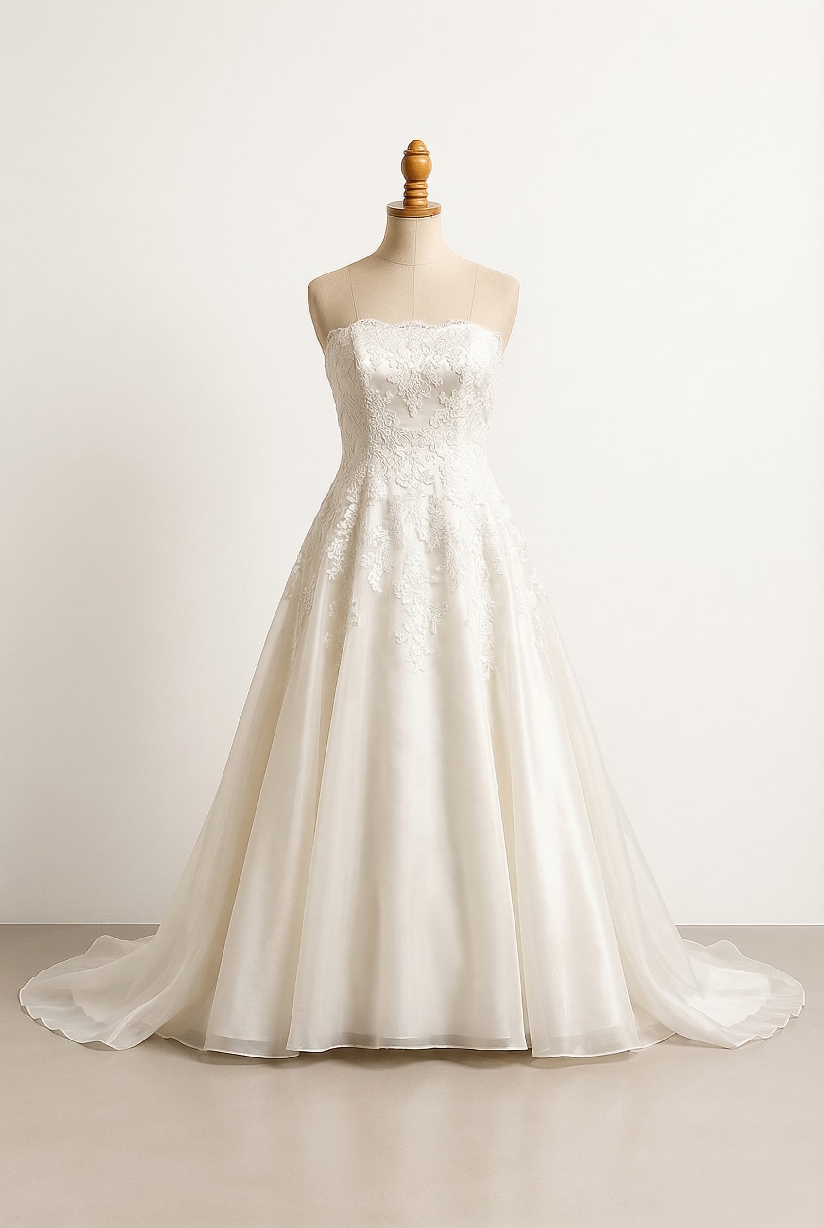 I want a balanced wedding dress Add a delicate overlay of Chantilly lace over the Duchess Satin for a softer more romantic texture A-line with a pearlescent organza skirt that reads as a single layer heavy lace on the bodice that fades out completely by mid-skirt with absolutely no lace at the hem or train The organza will be the top layer with a satin lining under. Bodice features a sweetheart neckline. Organza sleeves that go up and out creating a V shape in the organza and pleated, stopping just short of the shoulder, with the sweetheart neckline visible underneath.