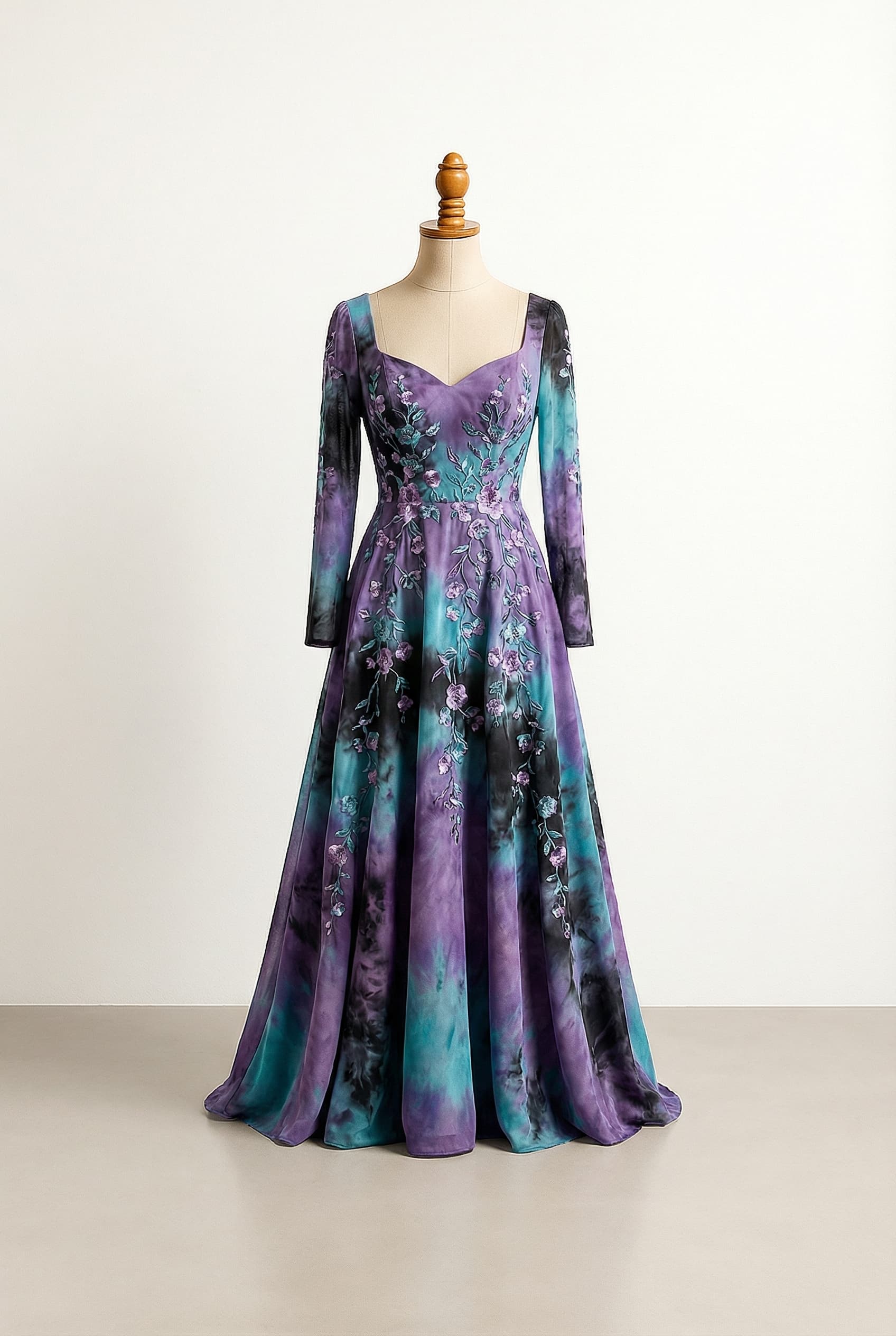 A romantic sleeveless A-line wedding dress made of lace, with an organically intermingled purple and black color scheme, featuring a sweetheart neckline, delicate floral embroidery with black accents scattered across the bodice and continuing down the front of the skirt, a graceful lace-up back, and a cathedral train.