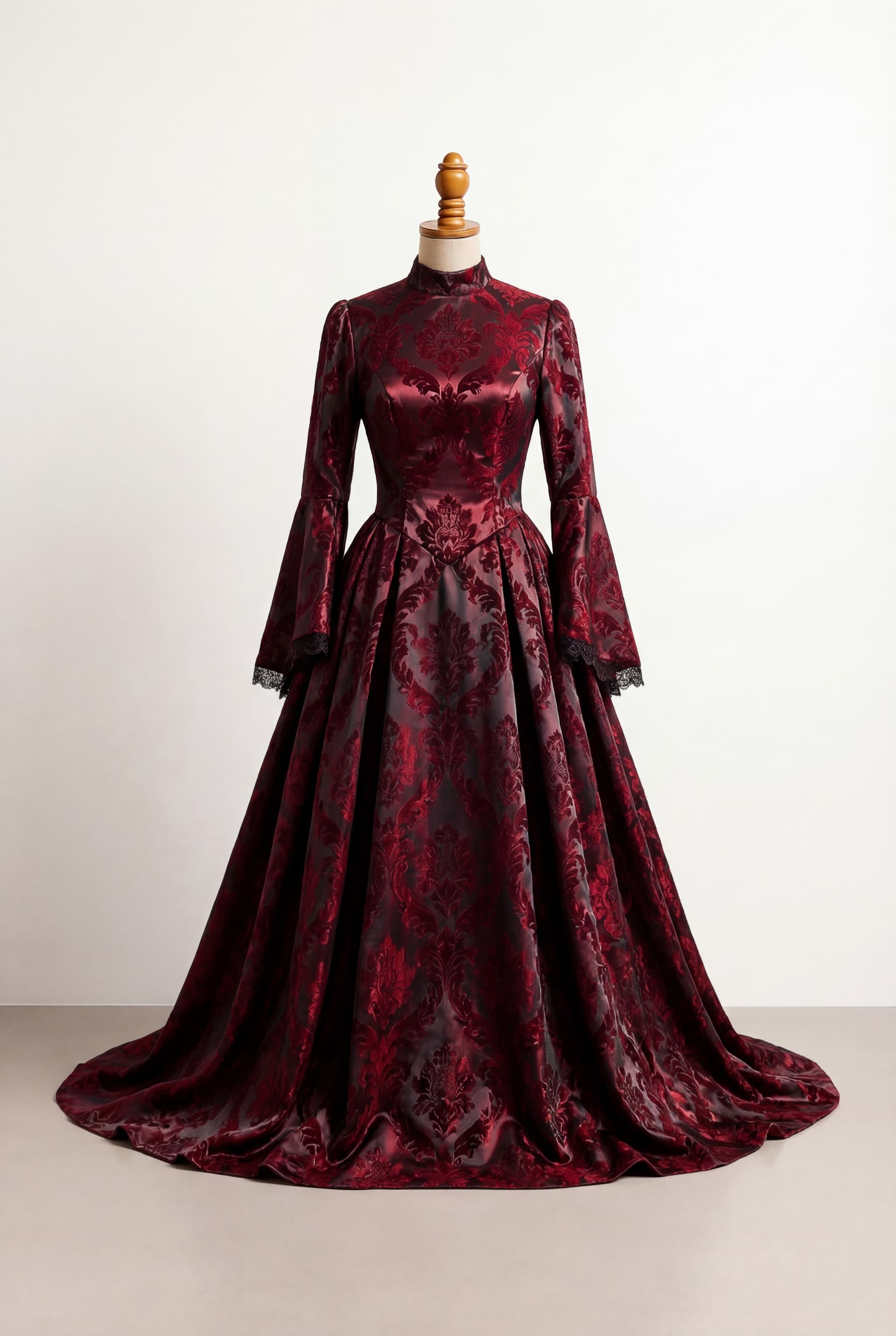 Floor length skirt in a regal radiance with a modern day Victorian theme Dark colors such as reds and blacks Formal and elegant Shoulderless sleeves and large slits for a modern look Black underlayer