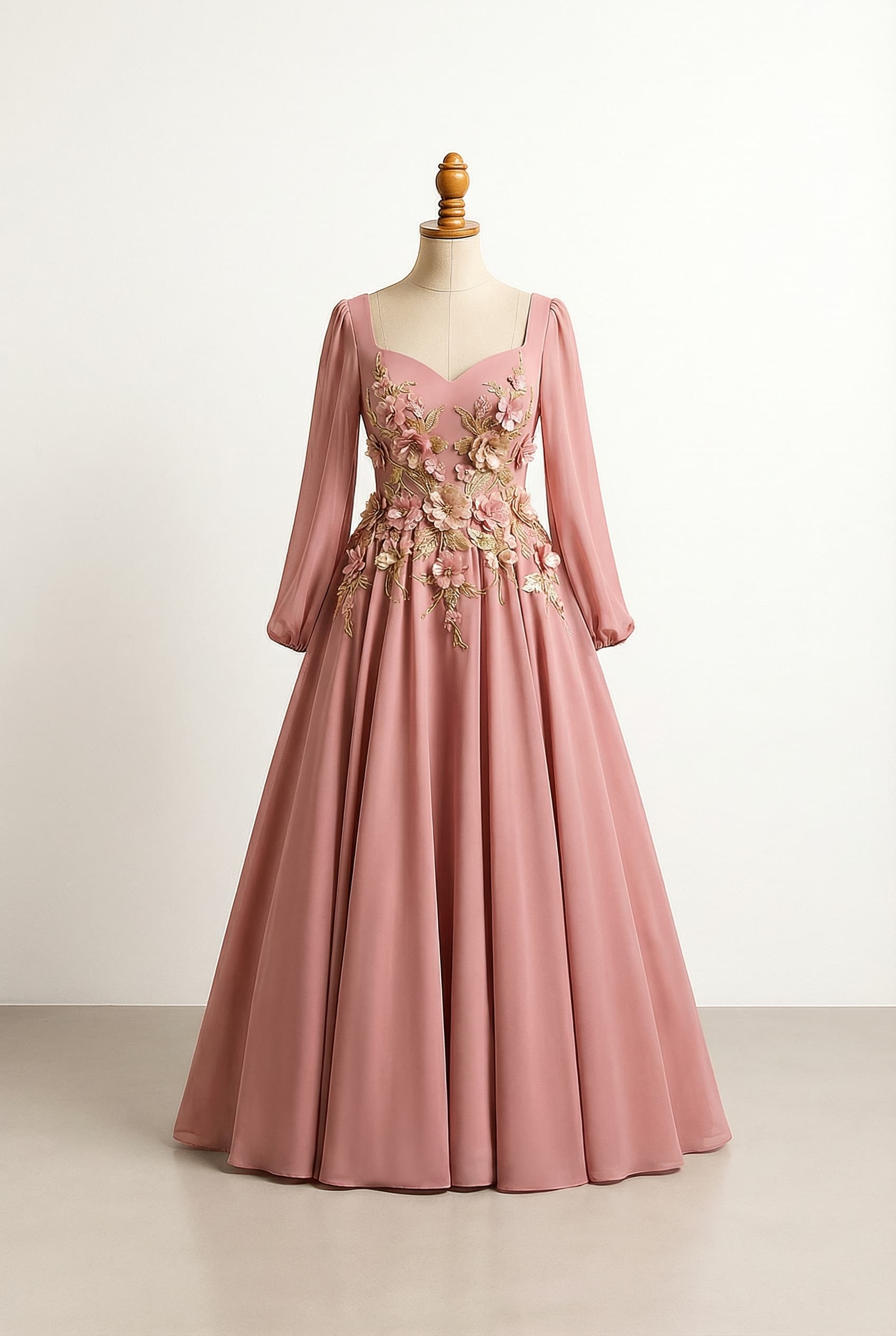 Glamorous prom dress in mid-dark toned pink, with long flowy sleeves, a ballgown silhouette with moderate volume (not overtly large), floor length, 4D flowers on the bodice placed below the sweetheart neckline and extending around the middle to where the skirt starts forming, and gold accents woven into the flowers and around other places.