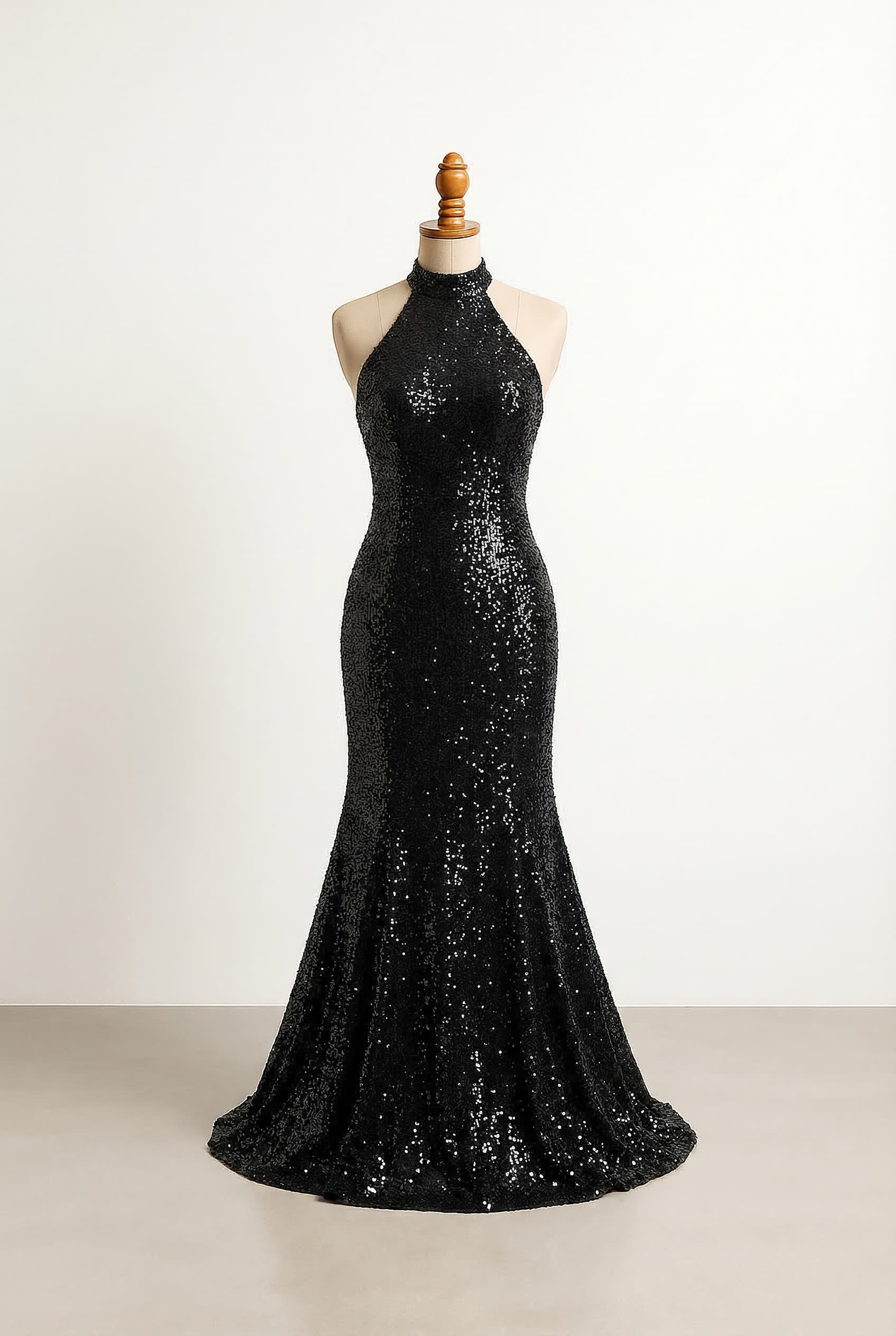 Black halter neck dress that flares out underneath the butt