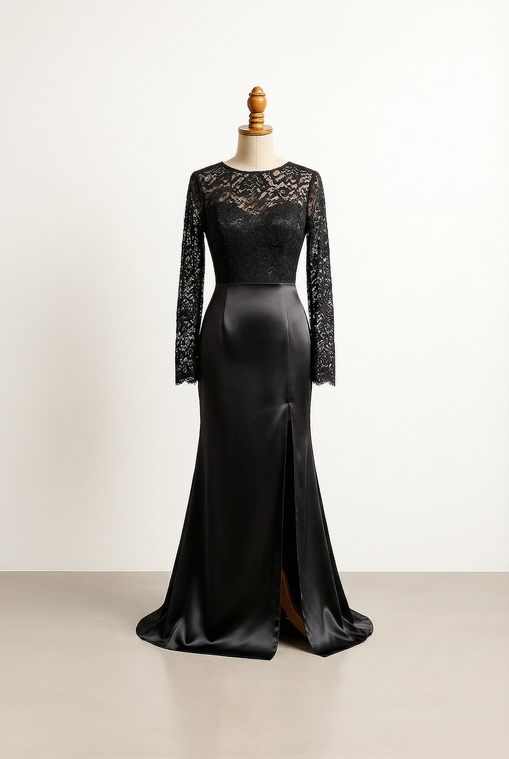 Fitted bodice with flowing sleeves black lace over satin black long skirt with a slit All black Lace on the skirt a tight corset heart cut top with spiderwebish lace