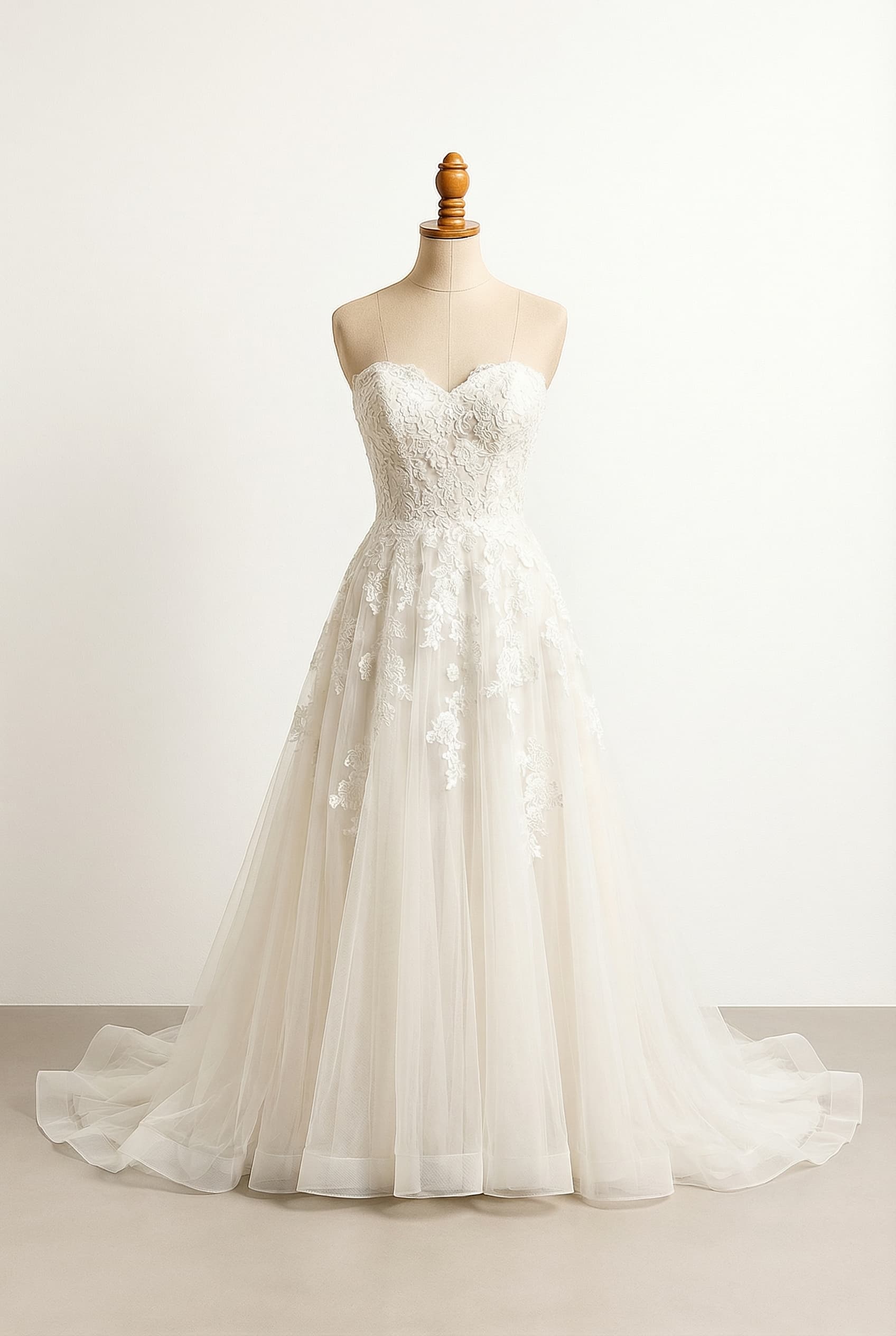 I want a balanced wedding dress with an A-line silhouette sweetheart neckline chapel-length train and floral design on tulle fabric