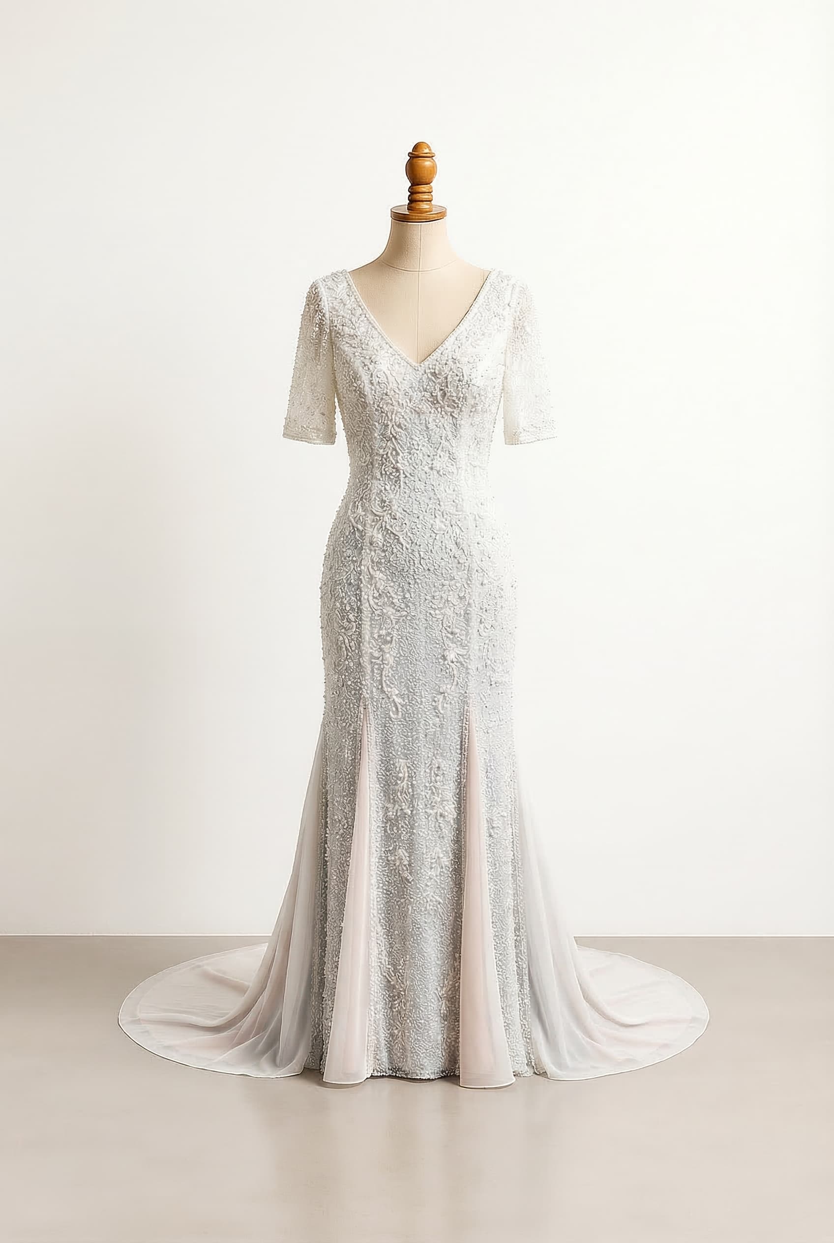 White wedding dress with pale dusty blue and blush pink underlayers