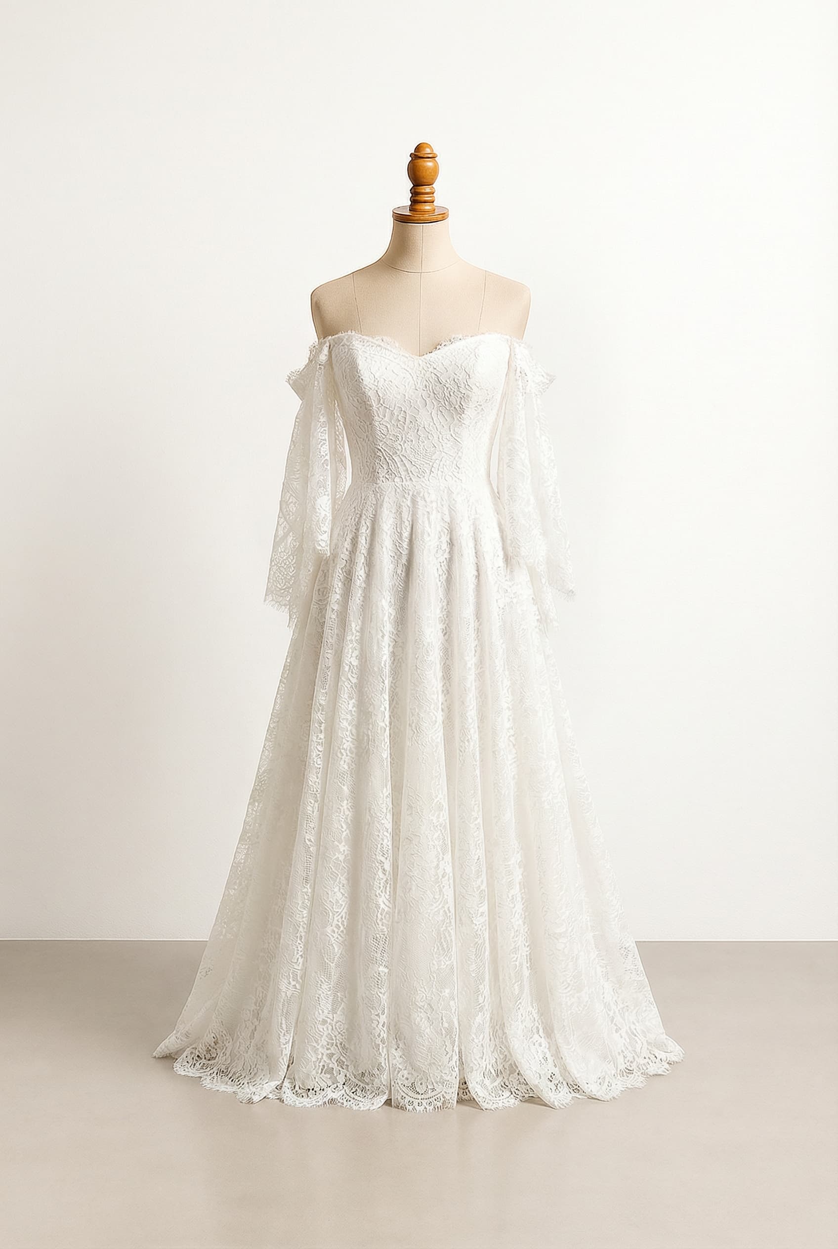 A romantic wedding dress with elegant details, a bodice adorned with delicate, soft, flowing lace, extending beautifully into the sleeves.