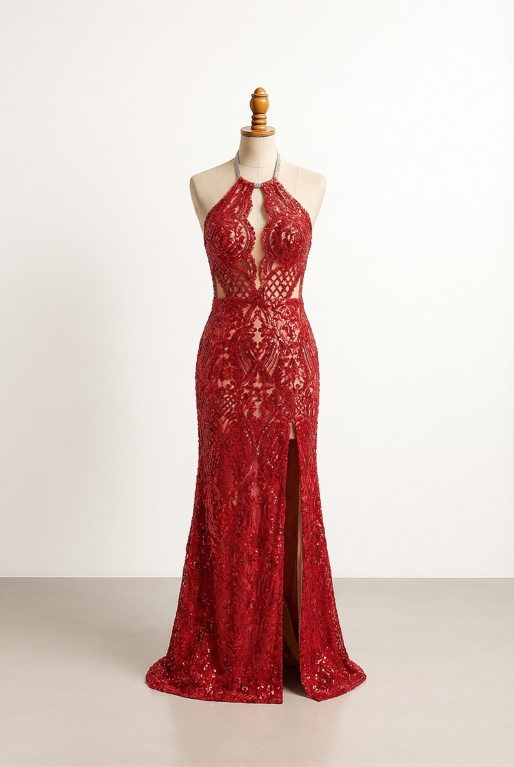 Revealing custom dress with a silver halterneck and a thigh-high slit and a full length