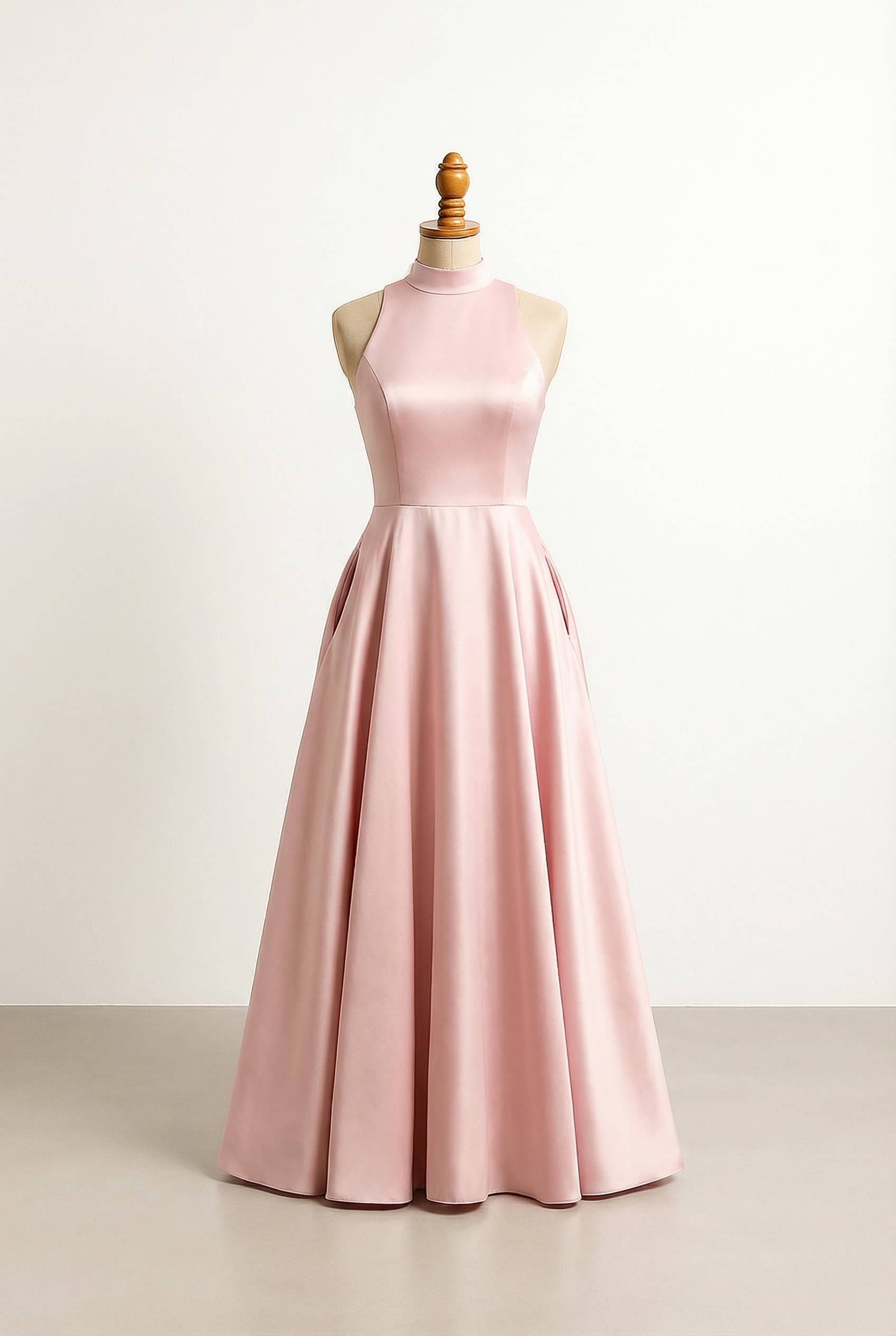 I want a balanced prom dress with a Soft high neck, floor length, made of satin, with a fun back that is crossed or open with a little swish to it and pockets. Pastel colors.