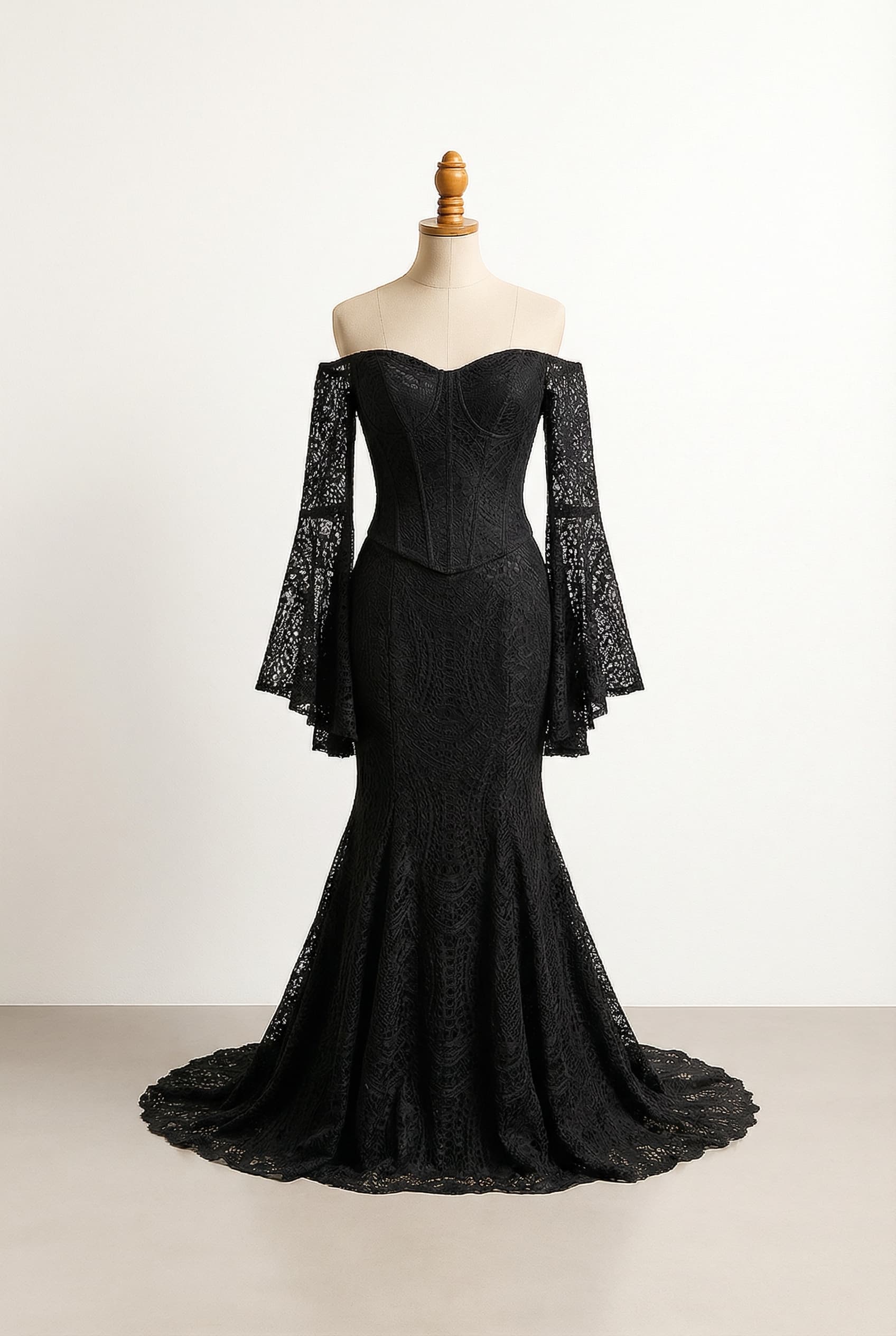 Elegant style with lower neckline or strapless options. I want a revealing wedding dress, gothic style. I want lace, shoulder less, flowy sleeves, a corset top and mermaid bottom.