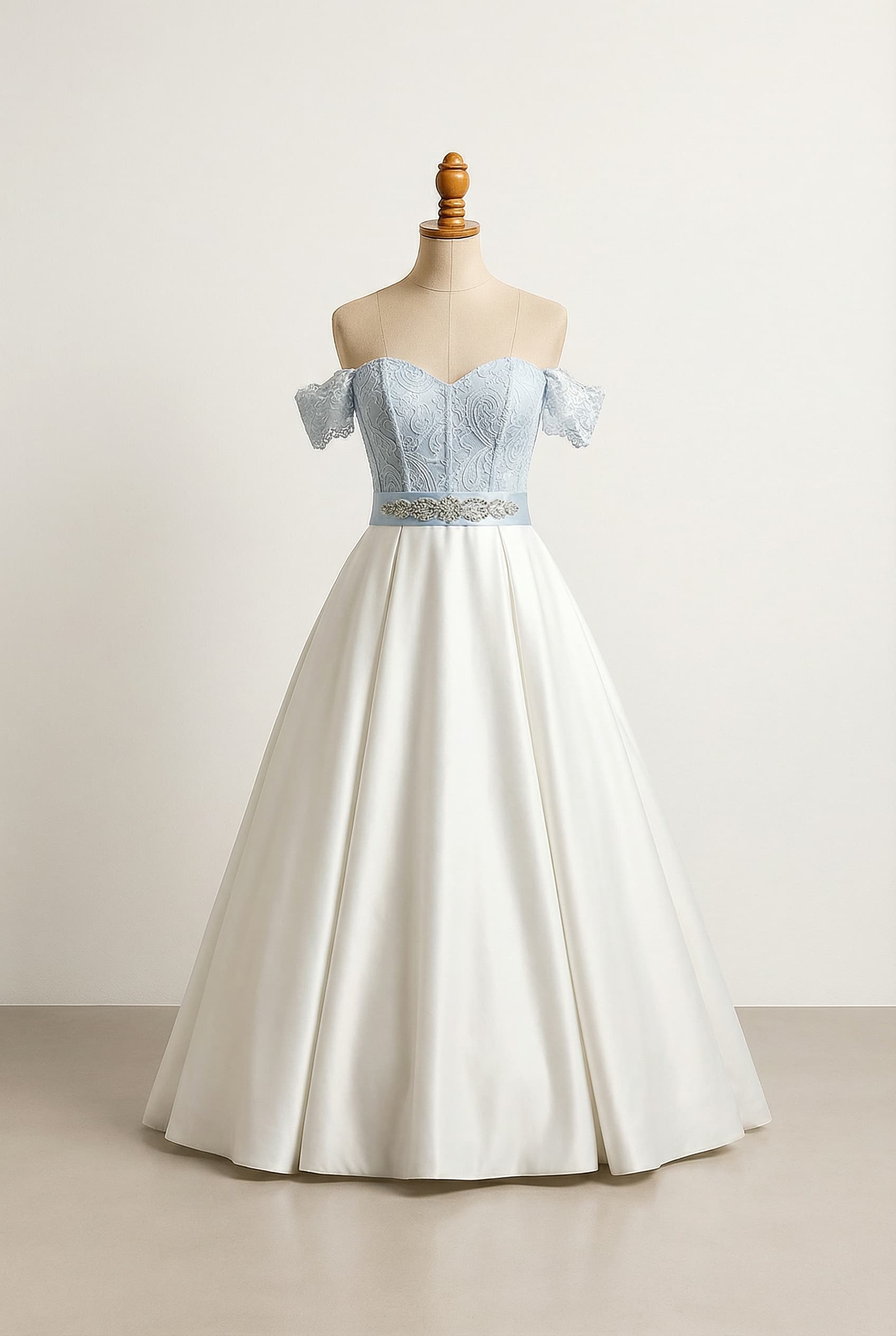 A romantic wedding dress with elegant details, featuring a light blue Paisley lace sweetheart corset top and matching off-shoulder sleeves, a natural waistline highlighted by a light blue sash and delicate beading, flowing into a graceful, floor-length white satin A-line ball gown skirt.