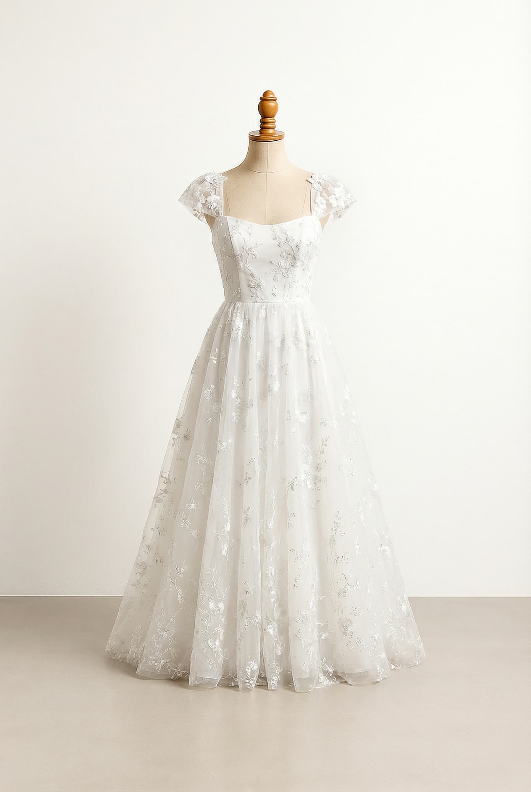 add white floral tulle skirt just touching the floor, and detachable white floral sparkle cap sleeves