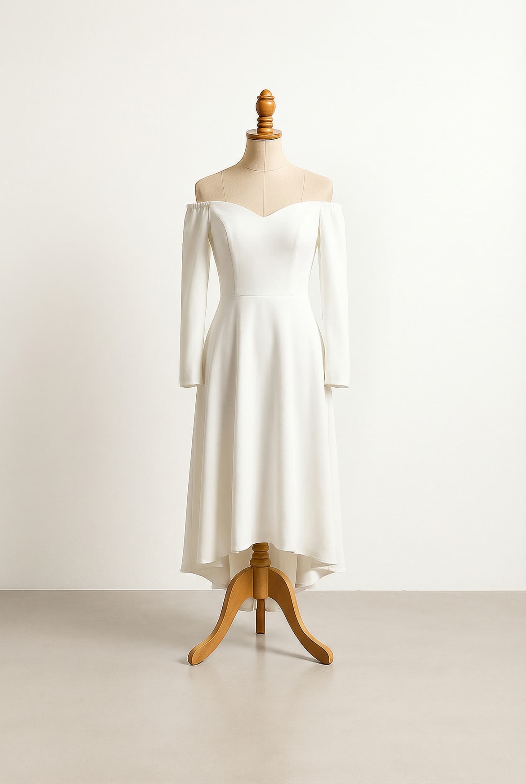 A romantic wedding dress with elegant details, featuring a high-low hemline.