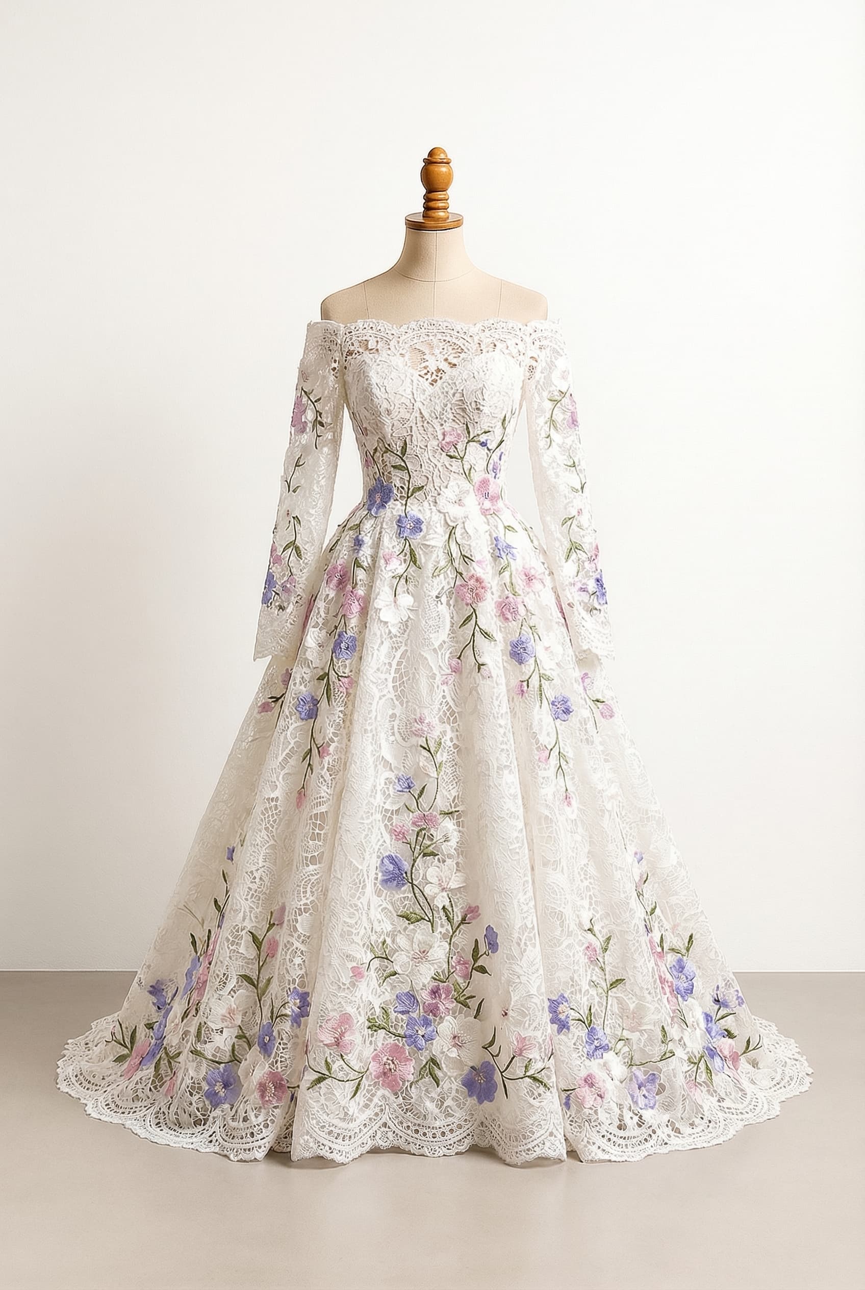 A-line or ball gown floor length gown with floral designs in white, off white or pastel pink trailing from the waist to the floor Off-the-shoulder neckline with sleeves that start in the middle of the upper arm and flow to the wrists or hands The sleeves also have floral designs that match the dress, with purple and pink and periwinkle floral embellishments and green vines/leaves