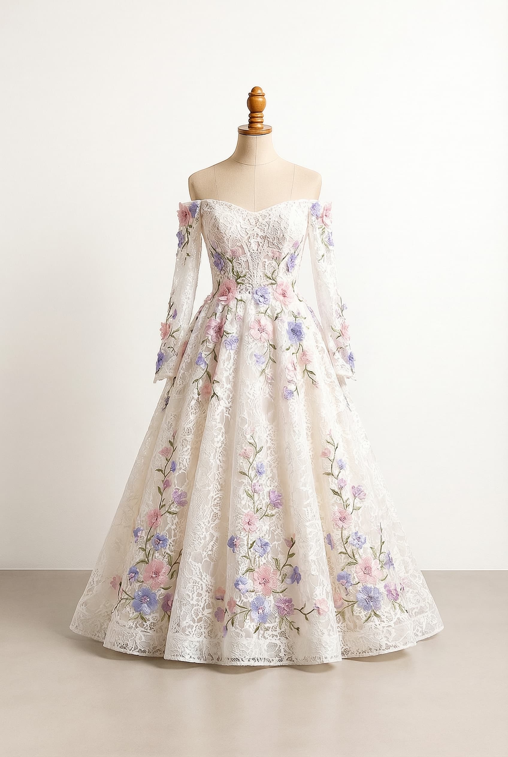 A-line or ball gown floor length gown with floral designs in white, off white or pastel pink trailing from the waist to the floor Off-the-shoulder neckline with sleeves that start in the middle of the upper arm and flow to the wrists or hands The sleeves also have floral designs that match the dress, with purple and pink and periwinkle floral embellishments and green vines/leaves