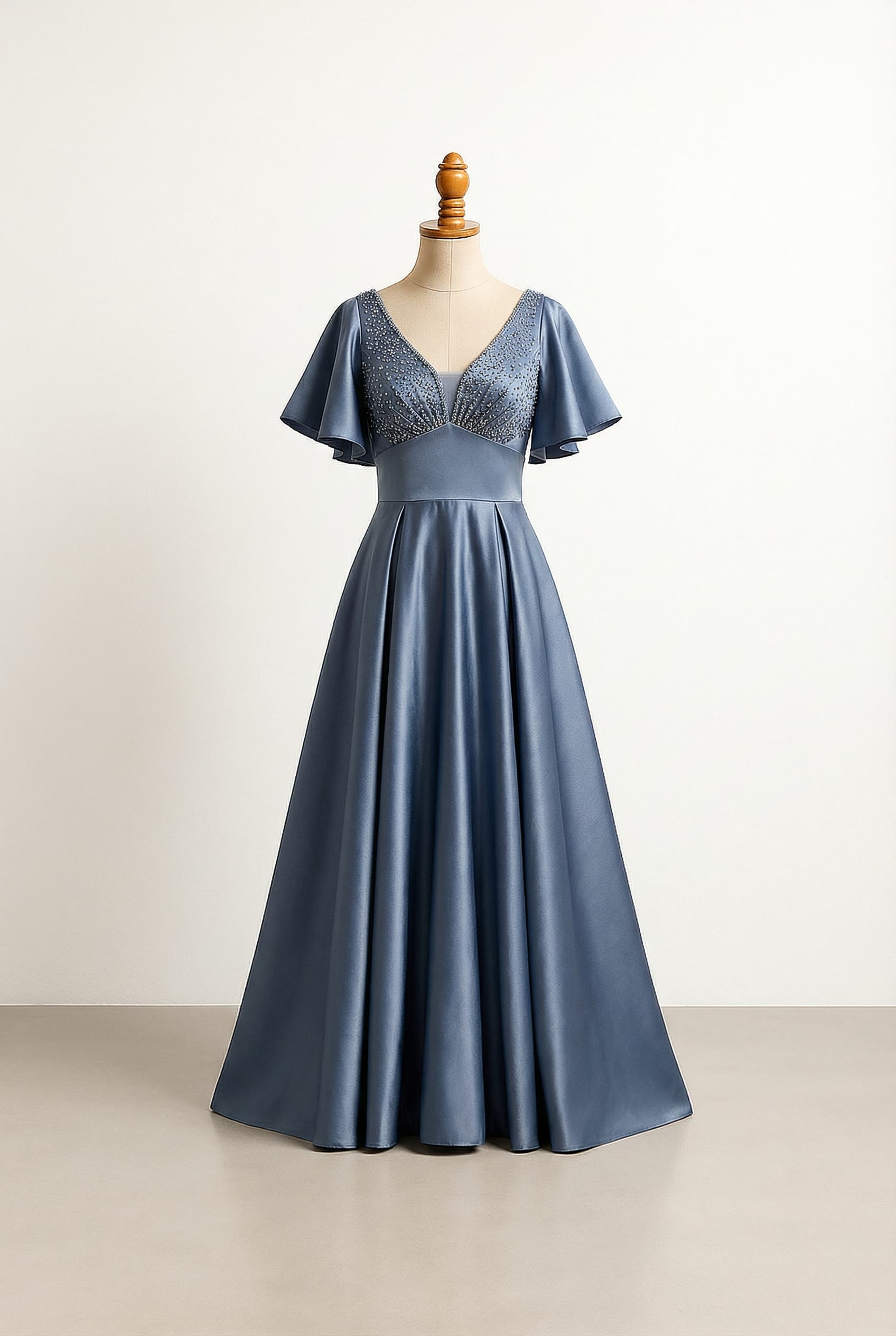 Empire waist with a-line to allow for wide hips and front pleats to apron belly. Sparkle on bust area and v neck ti accentuate upper body. Flutter sleeves; preset_type: Formal; modestyPreference: balanced; color: Slate Blue; length: Floor; sleeve: Flutter sleeves; neckline: V; waistline: Empire; silhouette: A–Line; fabric: Duchess Satin; imageUrl: https://build-a-dress.com/storage/v1/object/public/generated-images/e82e03d8-fc77-4f41-a6da-1764d84bdd53/c876a976-7672-4bf7-a7e1-0dc515ff077f_front_variation_1.png; isLoggedIn: true