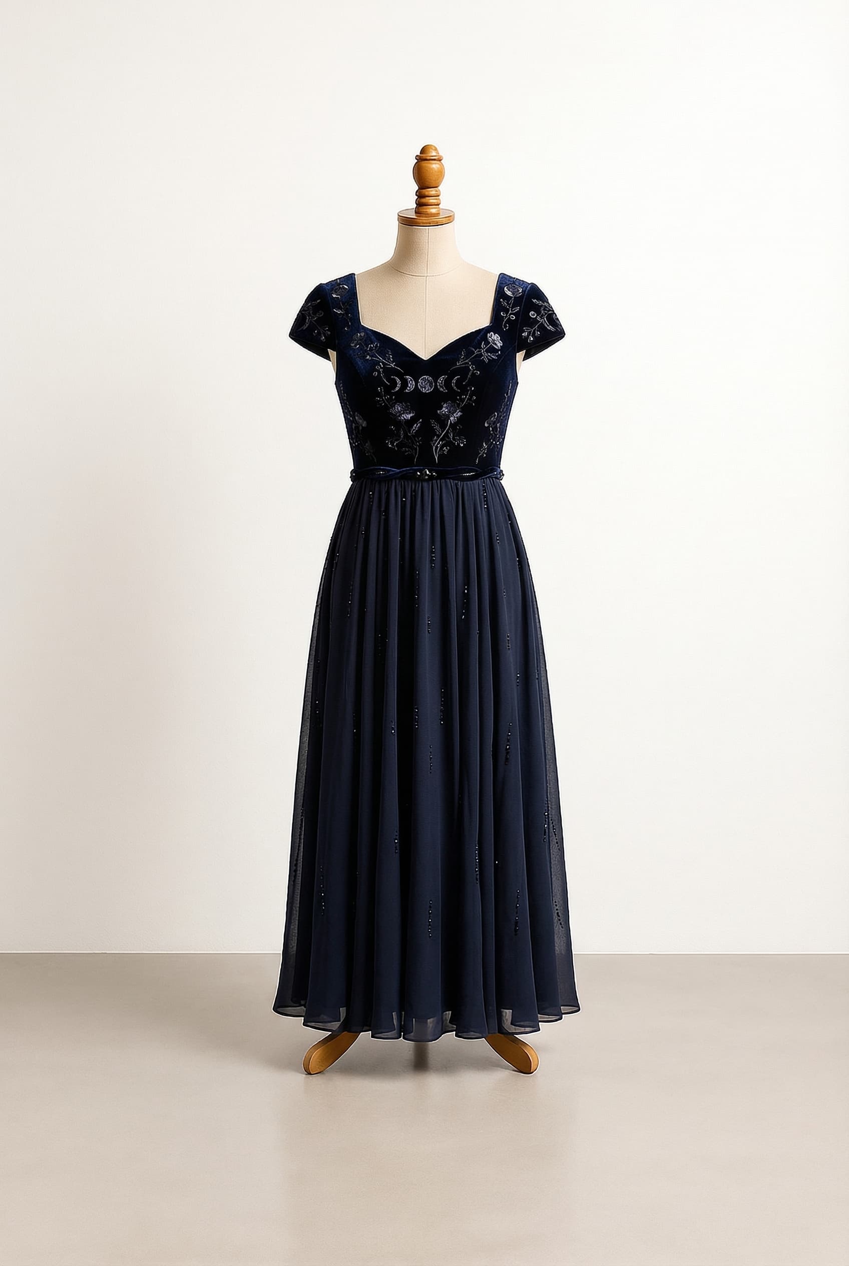 I want a balanced prom dress an Empire waist style dress that reminds you of the dark beautiful creature in an enchanted forest more picture the women looking creature that appear at night under the moonlight. To around the ankles or so, short sleeves that cover your shoulder, either a v-neck or a sweetheart neck.