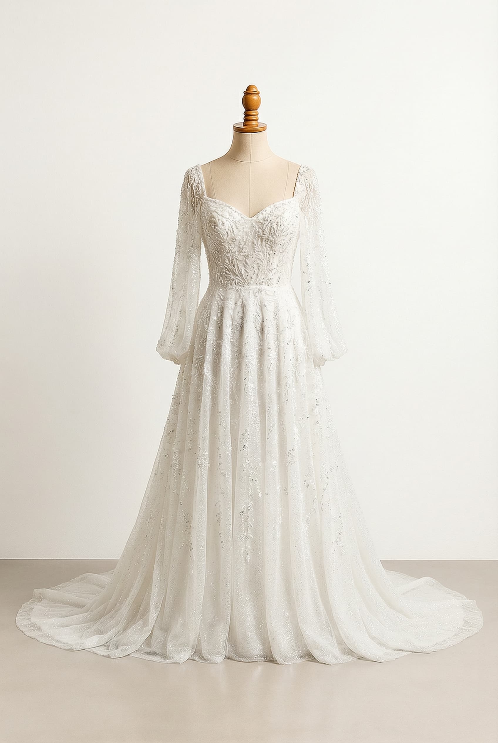 A romantic wedding dress with elegant details, glittery and shiny with beaded embroidery, and loose, draping long sleeves