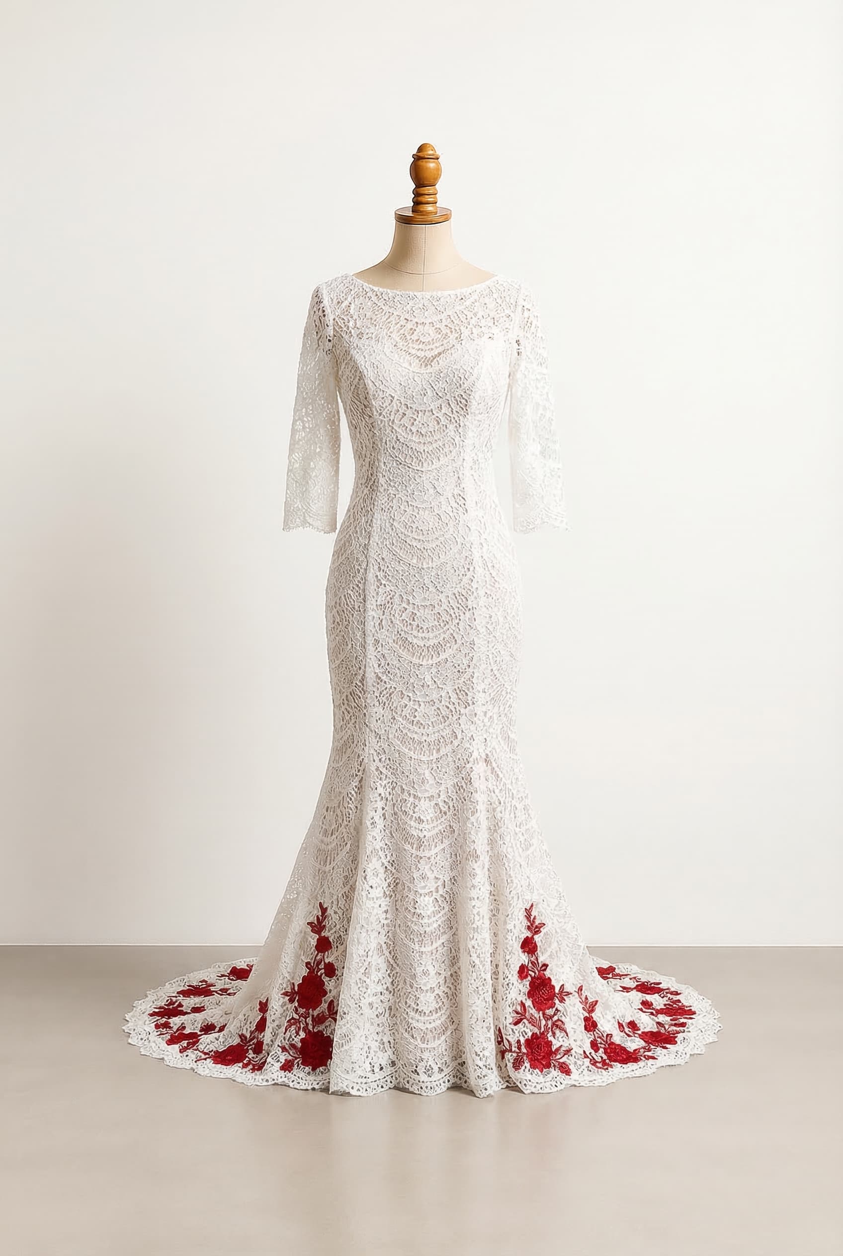I want a balanced wedding dress with white fabric and red floral embroidery on the edges of the bottom of the train modest on the chest and arms princess silhouette 34th sleeves airy and light fit and flare fitted through the waist and hips then gently flares out Chapel - Slight train 1-2 feet past feet Boat neck in tulle