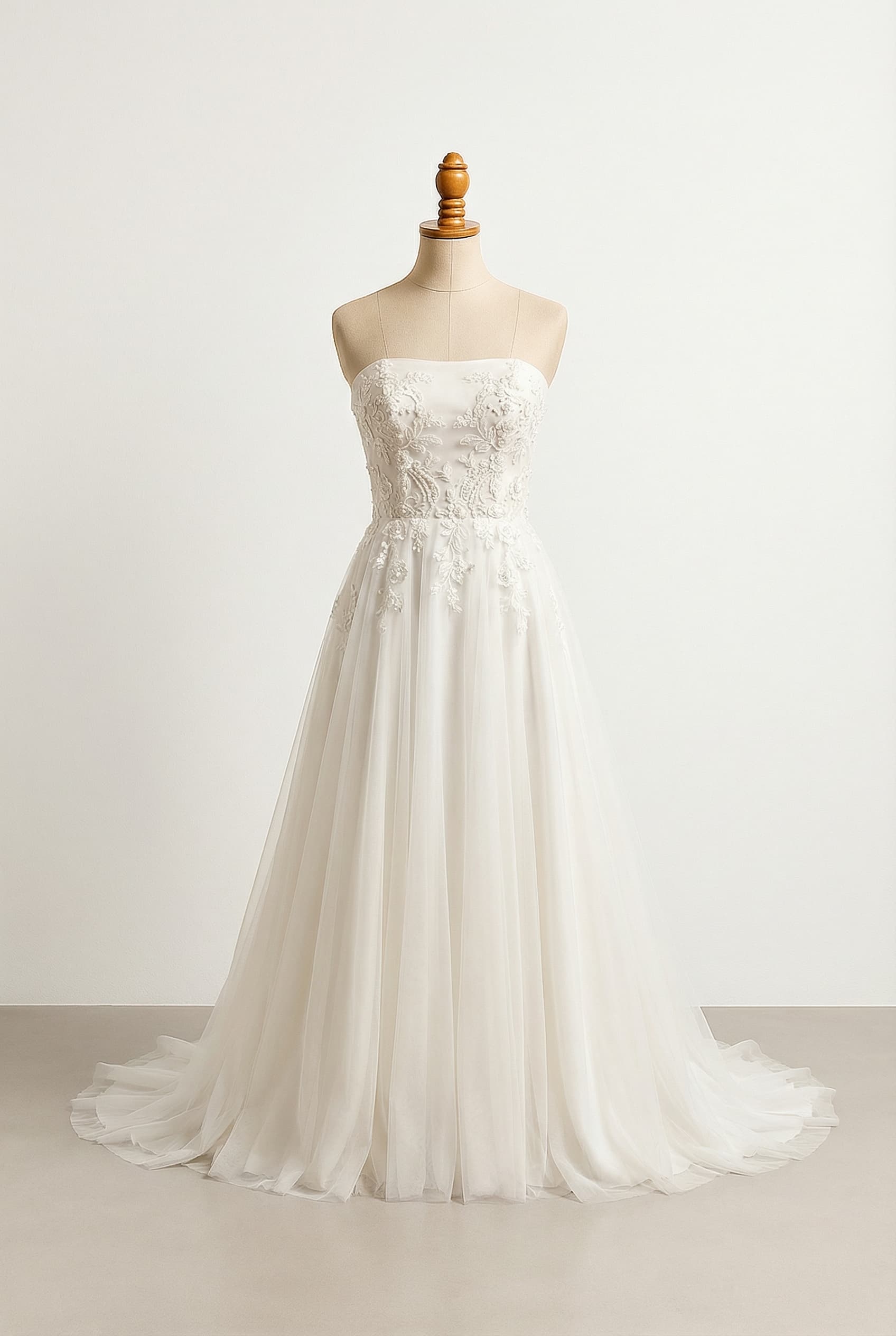 A romantic wedding dress with elegant details; A-line skirt from the natural waist; crisp white strapless bodice