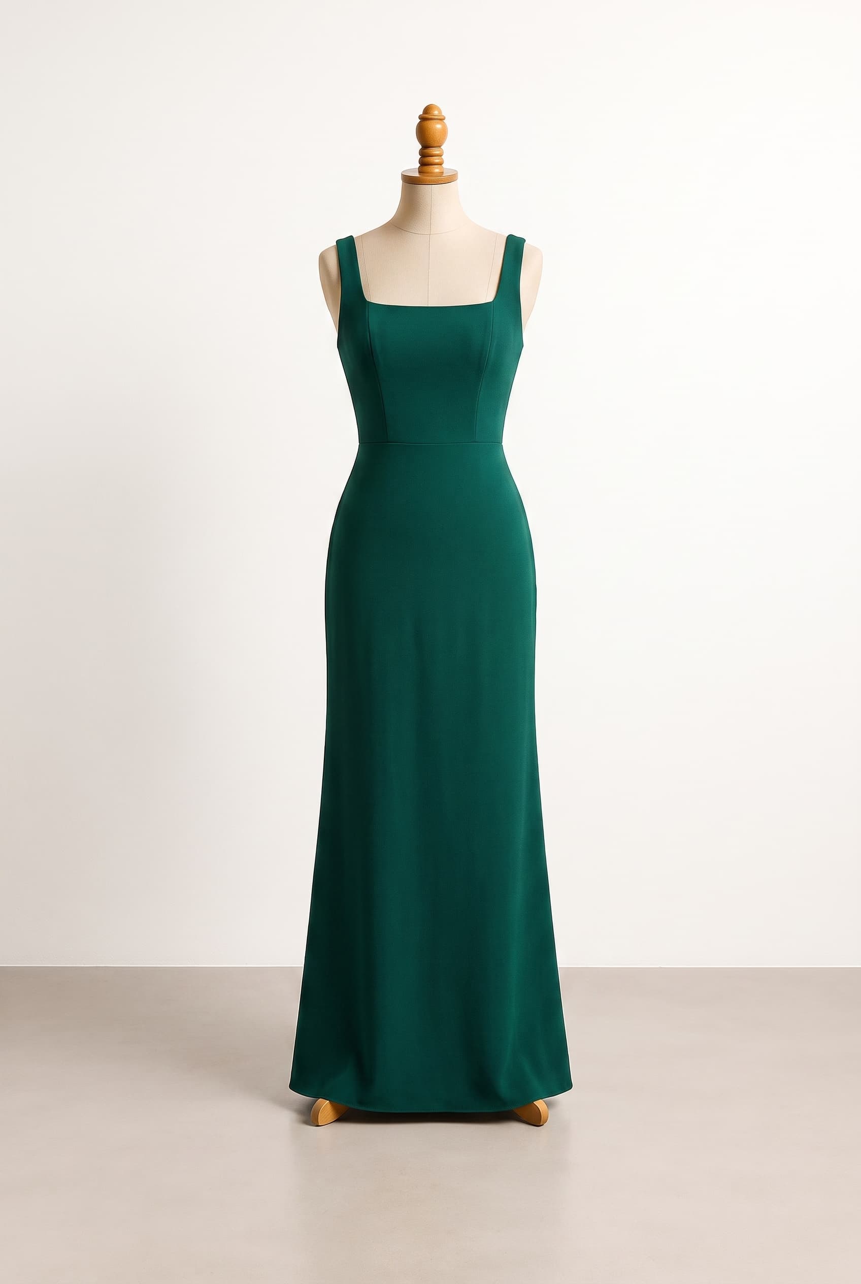 A sleek, contemporary bridesmaid dress with a clean column shape, sculpted waist, and understated editorial polish; A smooth, lightly structured bodice with subtle princess seams and a crisp square neckline for an editorial finish