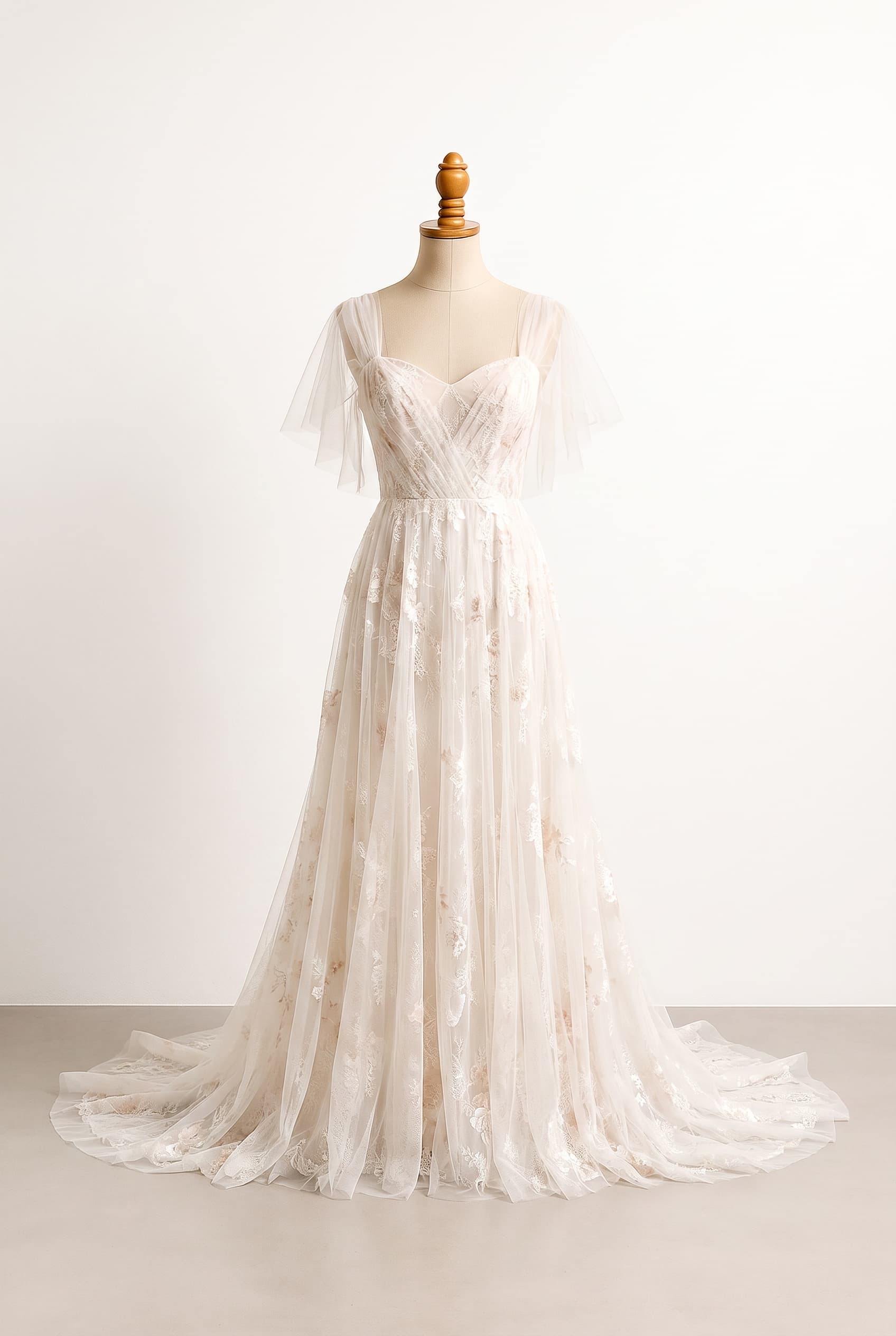 An airy, ethereal wedding dress inspired by a blooming garden, with soft movement, delicate texture, and a relaxed romantic elegance